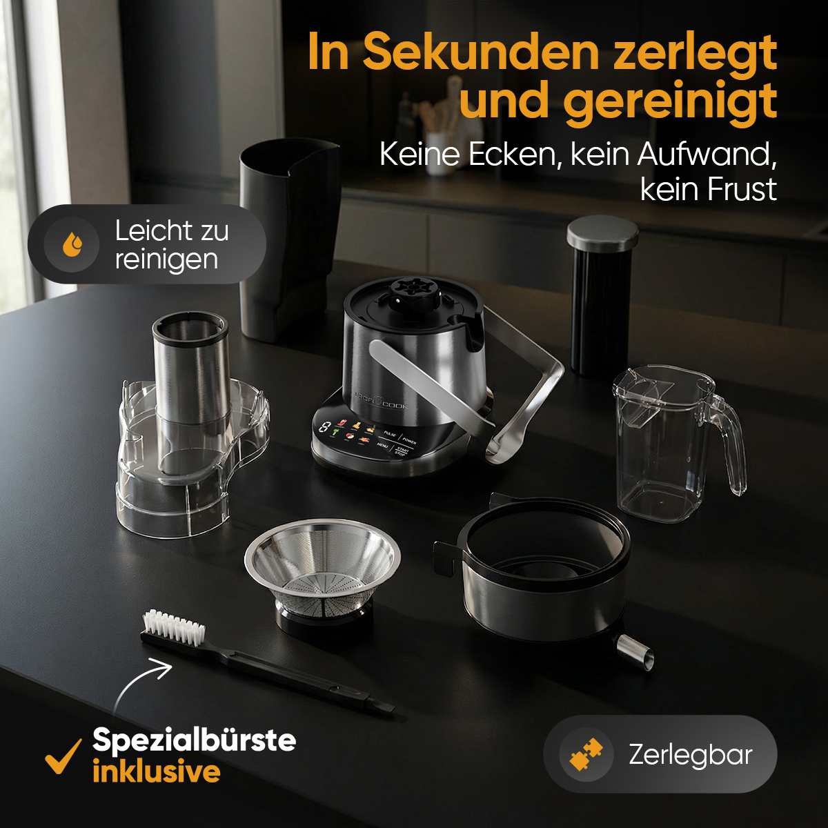 Küchenmaschine mit Zubehör auf schwarzer Arbeitsplatte. Leicht zu reinigen.