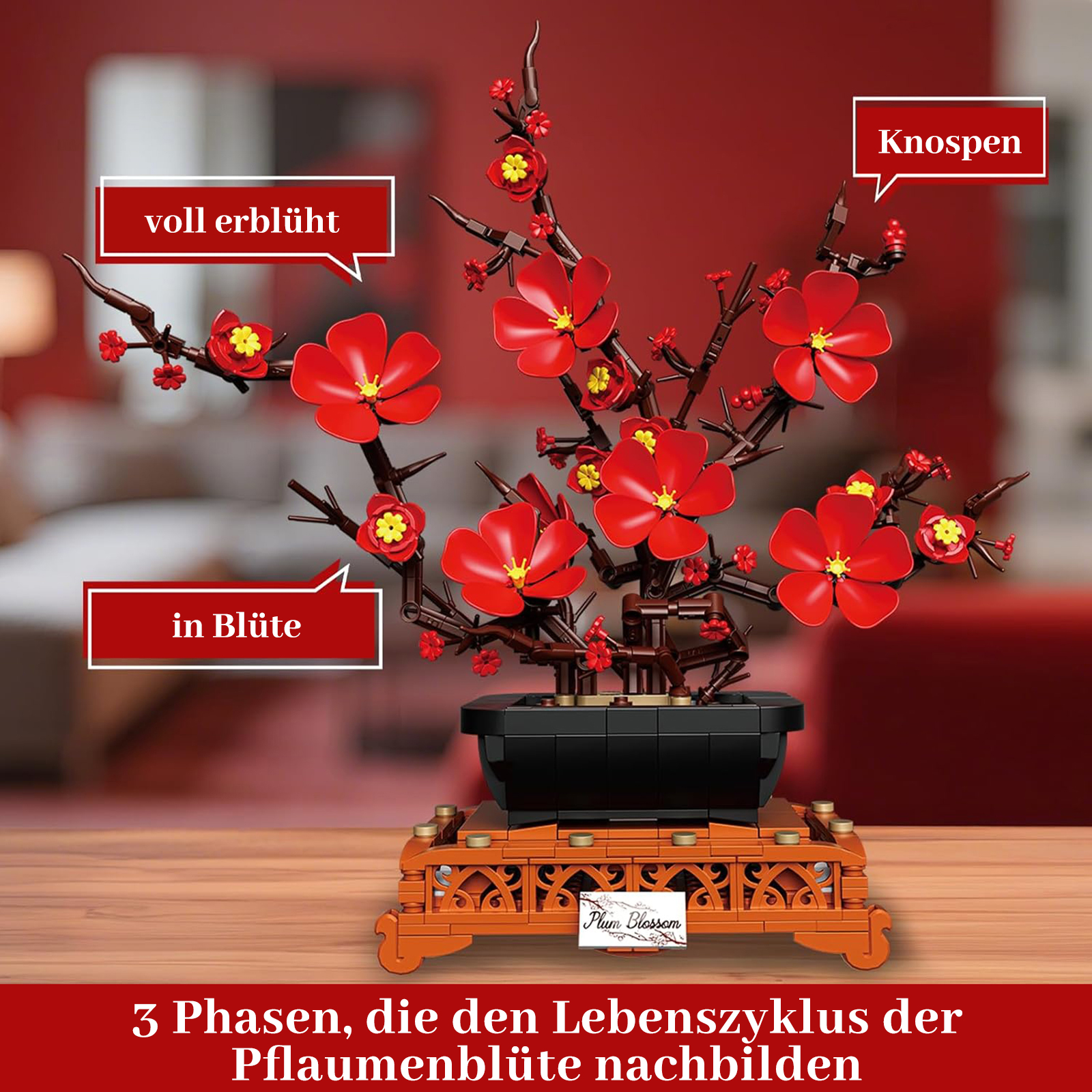 Ein Spielzeugmodell eines blühenden Pflaumenbaums mit roten Blüten und Knospen.