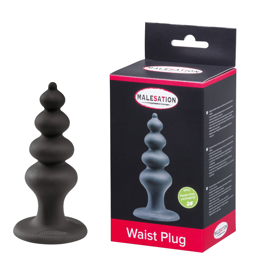 Ein grauer Taillenstecker mit einer gewellten Form, daneben die Verpackung.