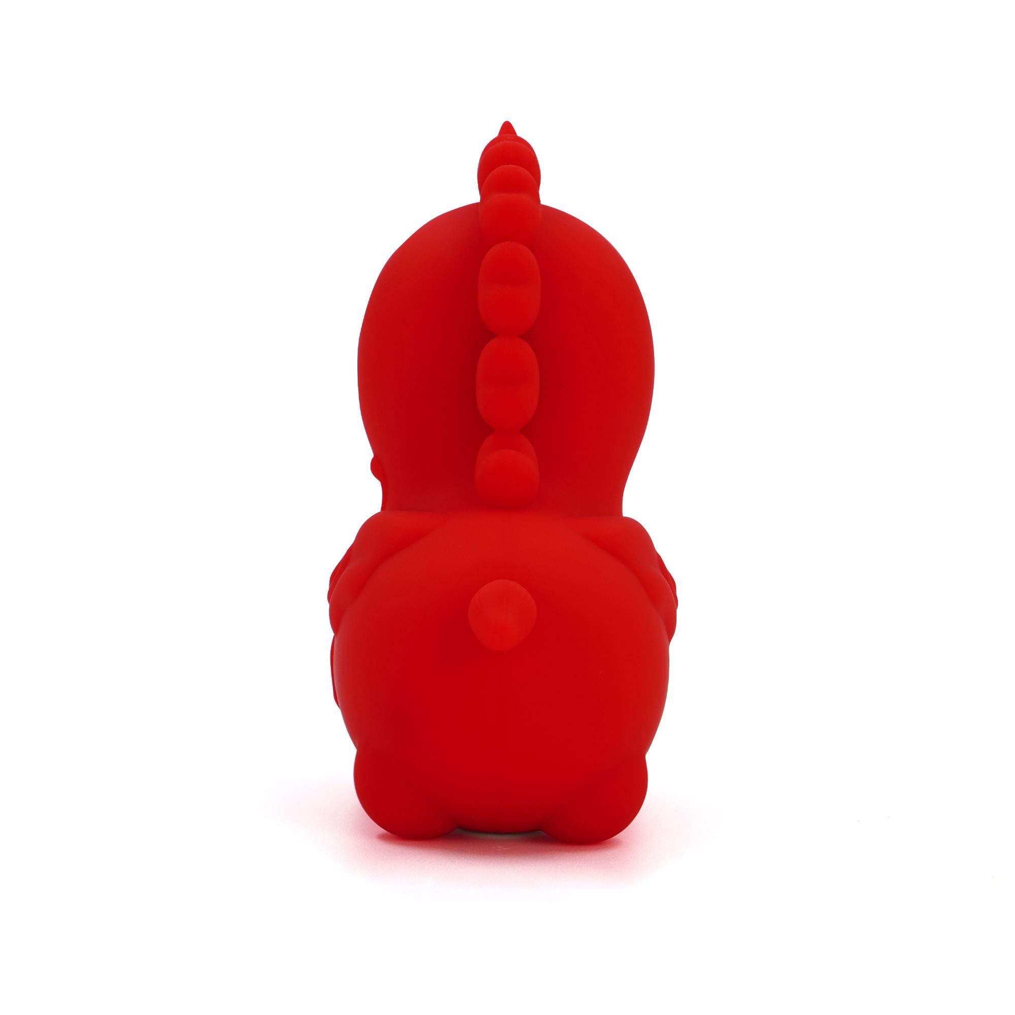 Ein rotes Gummitier-Dinosaurier-Spielzeug von hinten mit einer Reihe von Stacheln auf dem Rücken.
