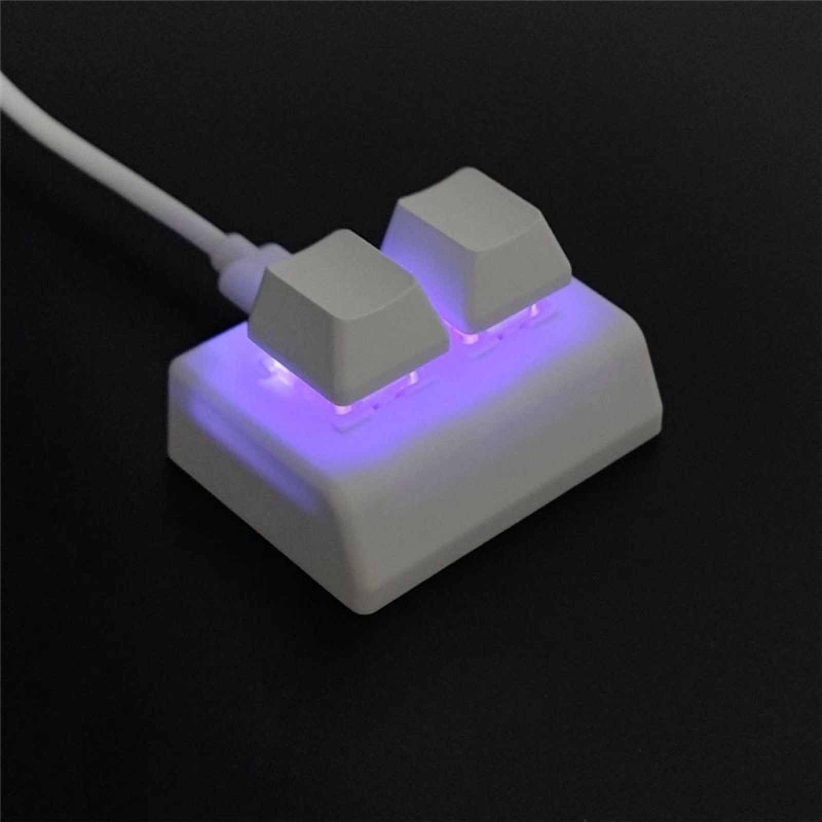 Ein weißes Tastatur-Makro mit zwei Tasten, das mit lila Licht leuchtet.