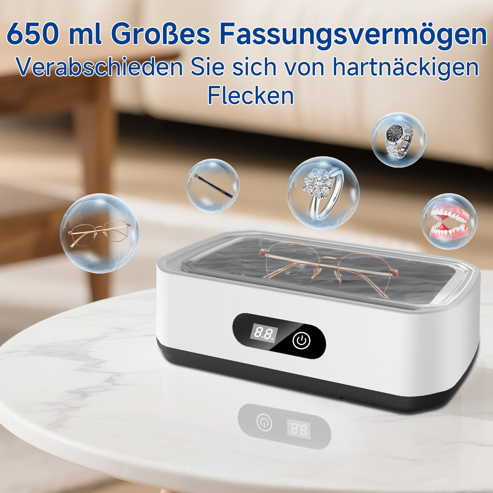 Ultraschallreiniger mit Brille, Ring, Uhr, Gebiss und Bürste im Blasen.