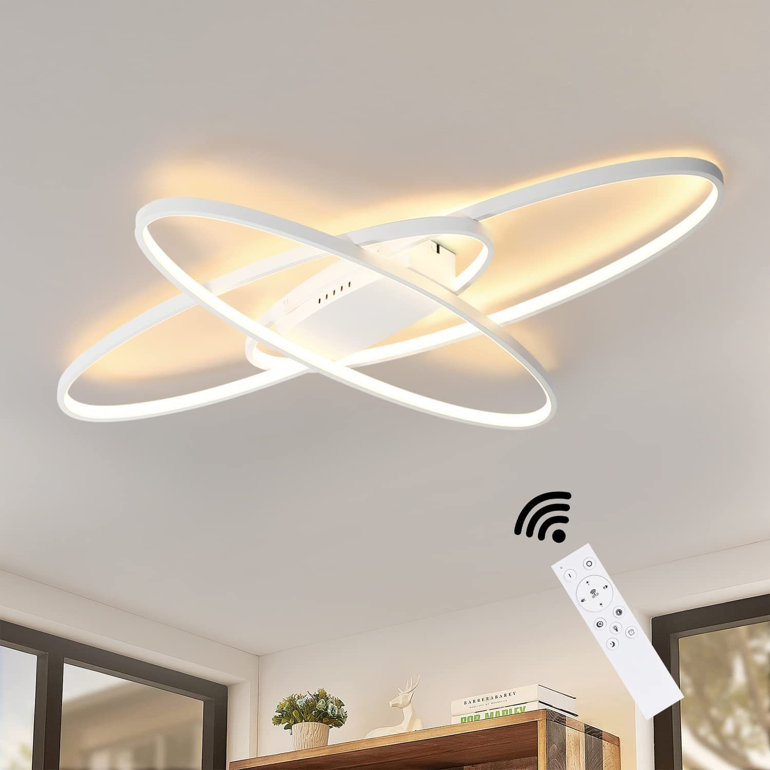 Moderne weiße Deckenleuchte mit verschlungenen Ringen, eine Fernbedienung ist abgebildet.