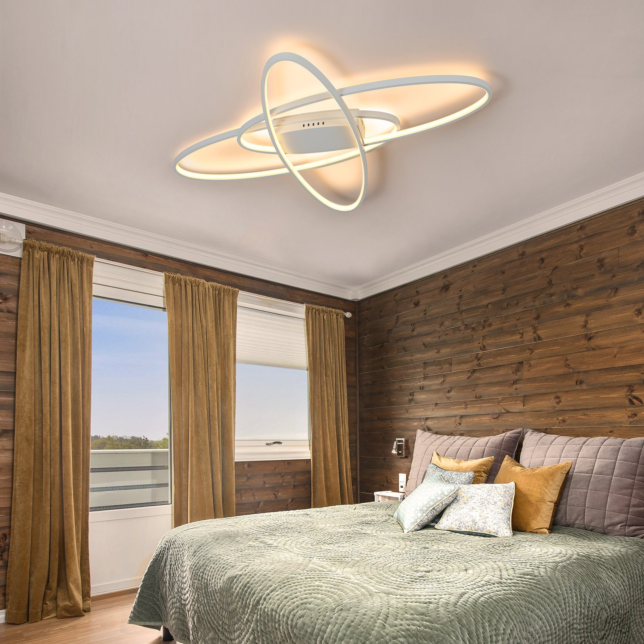 Ein modernes Schlafzimmer mit Holzwand, Bett und Hängeleuchte.