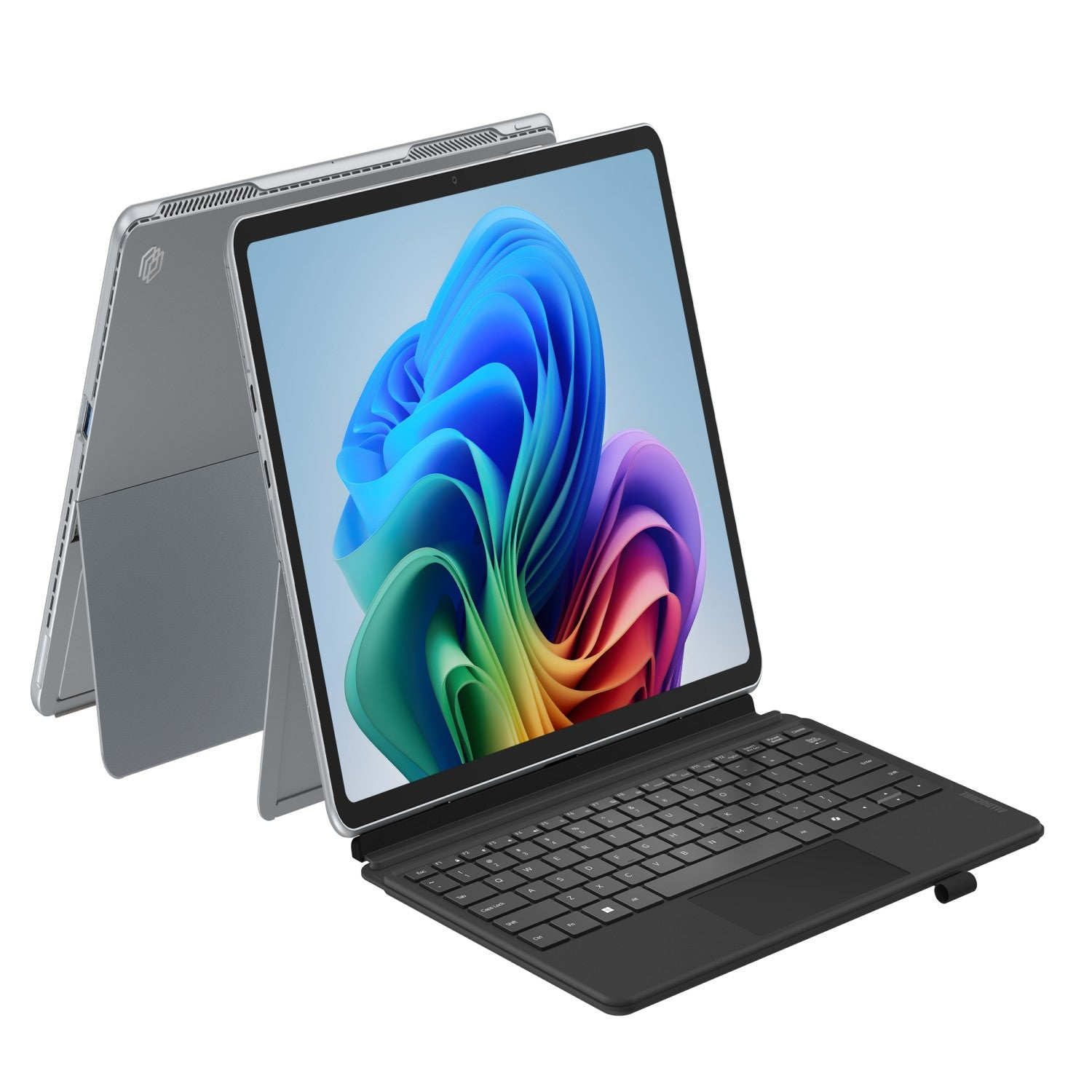 Un portátil plateado con teclado desmontable, que muestra un fondo de pantalla colorido.