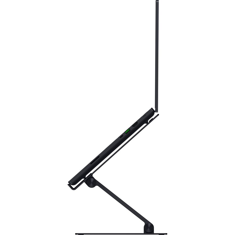 Black laptop on a stand, viewed from the side. A green light is illuminated.