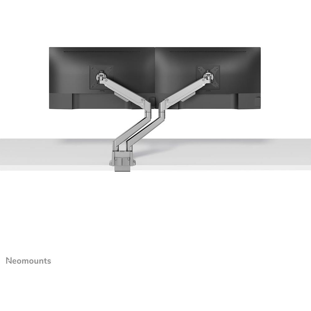Two black monitors on a silver dual monitor arm stand on a white surface.