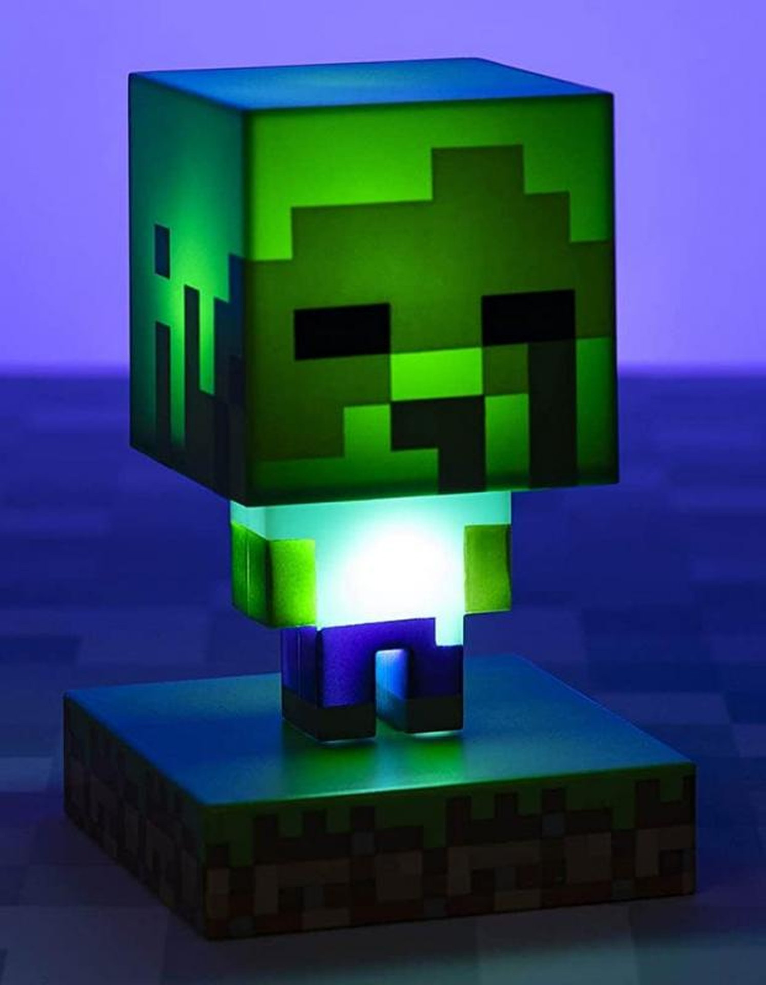 Grüne Minecraft-Zombie-Lampe auf einer Minecraft-Grasblockbasis.