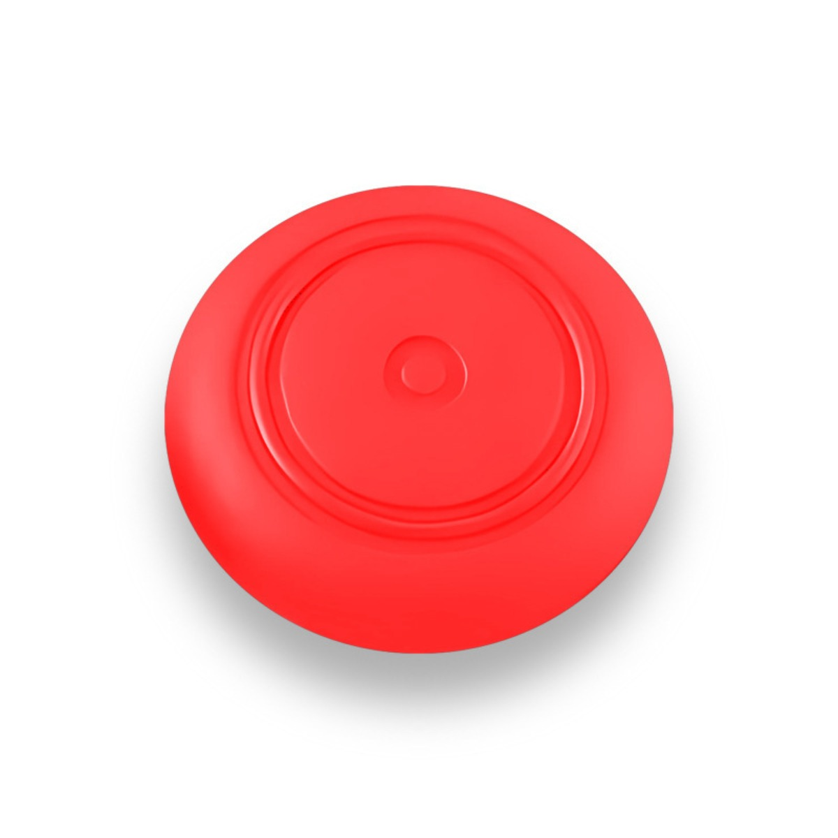 Un frisbee rouge avec des cercles concentriques et un bouton central.