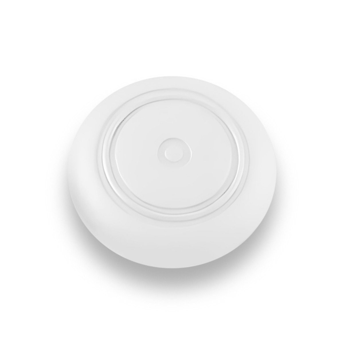 Un objet blanc et rond avec des cercles concentriques et un petit cercle au centre.
