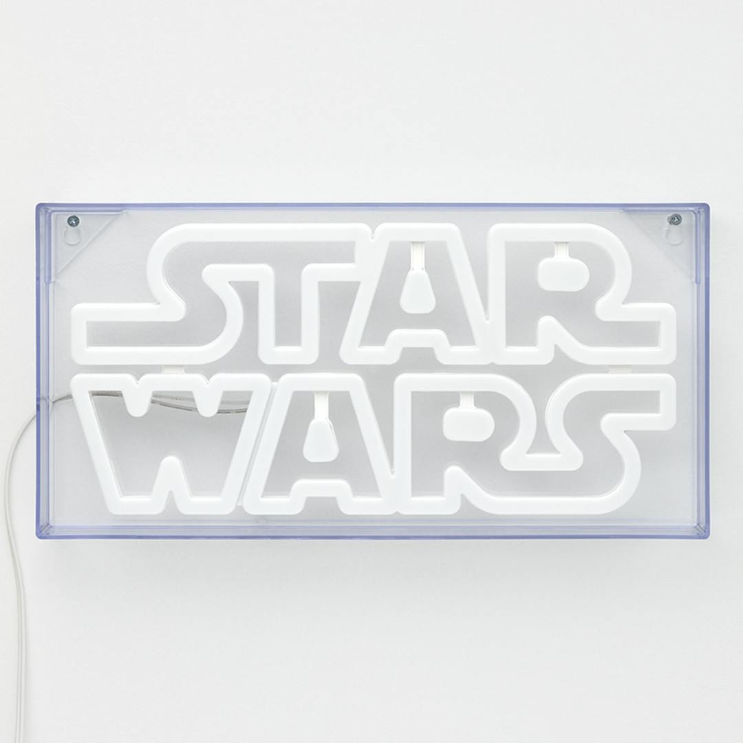 Biay neonowy znak "STAR WARS" w przezroczystej obudowie.