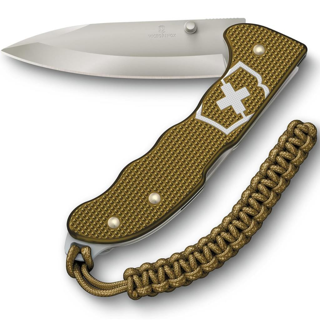 Beyaz İsviçre haçı amblemli altın Victorinox cep bıçağı ve paraşüt ipi lanyard.
