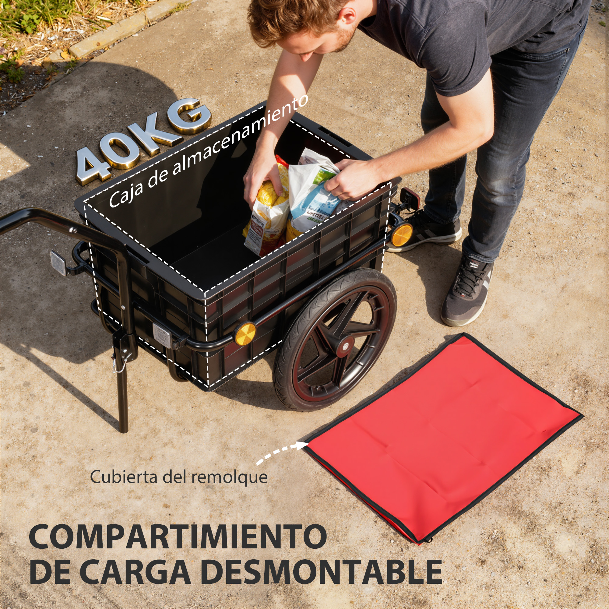 Hombre carga remolque negro de 40kg, lona roja al lado.