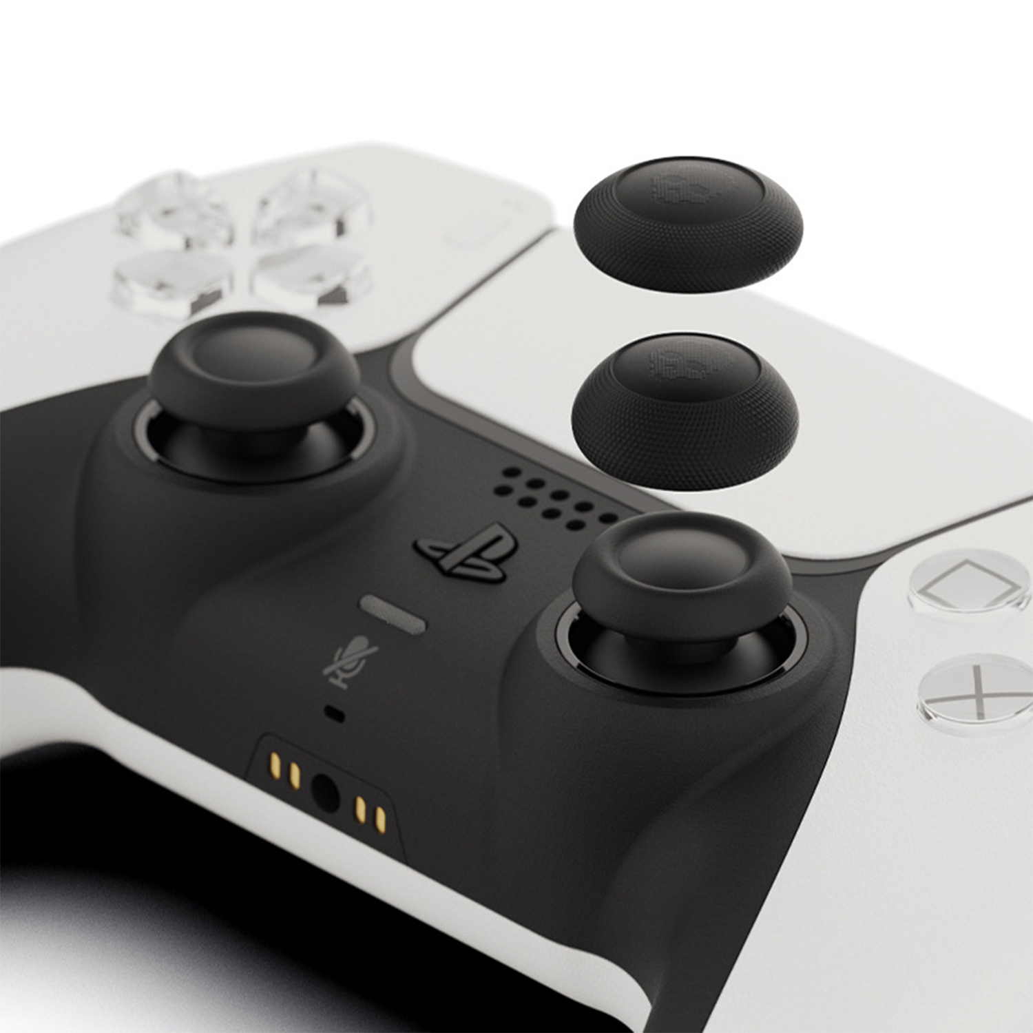 Twee zwarte duimgrips voor een witte controller, met gestructureerde oppervlakken.