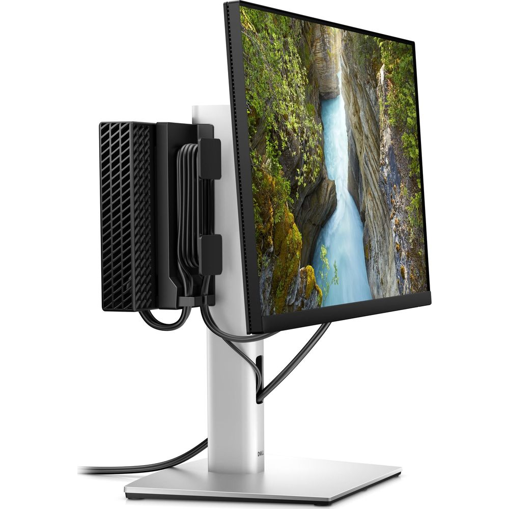 Un mini PC nero è fissato a un supporto per monitor argentato che mostra una cascata.