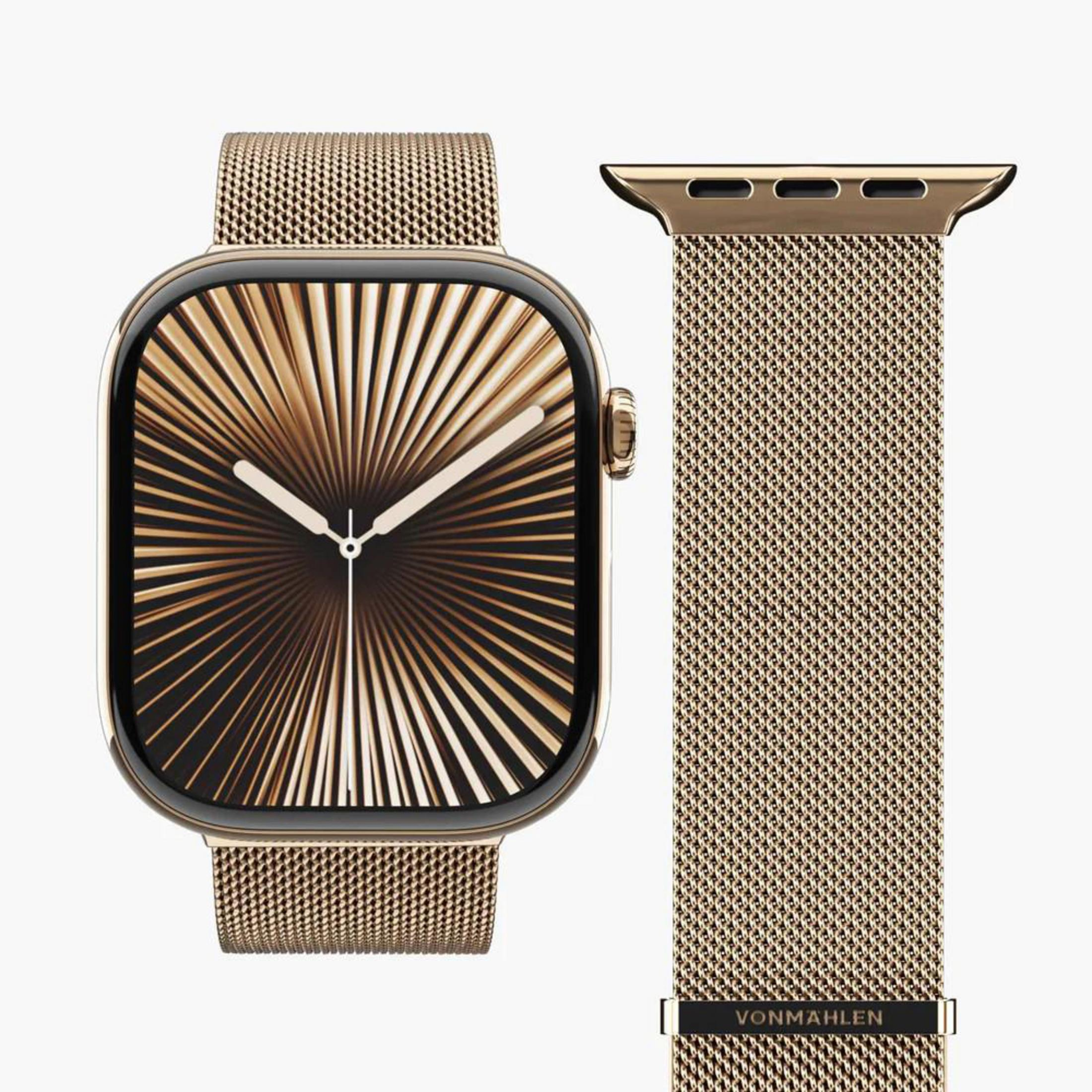 Une montre connectée dorée avec bracelet en maille et cadran abstrait.