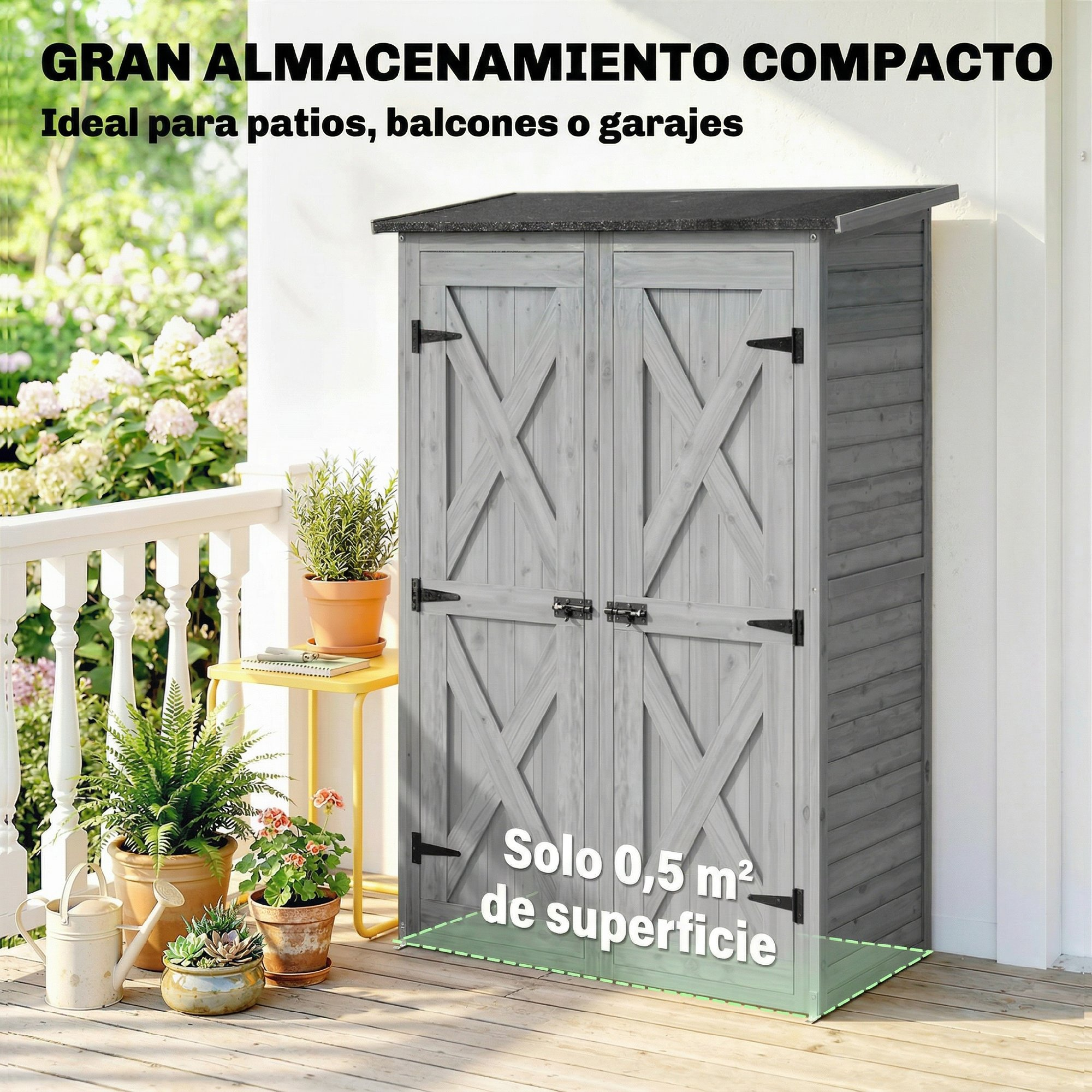 Un cobertizo de madera gris con puertas dobles en una terraza de madera con plantas.
