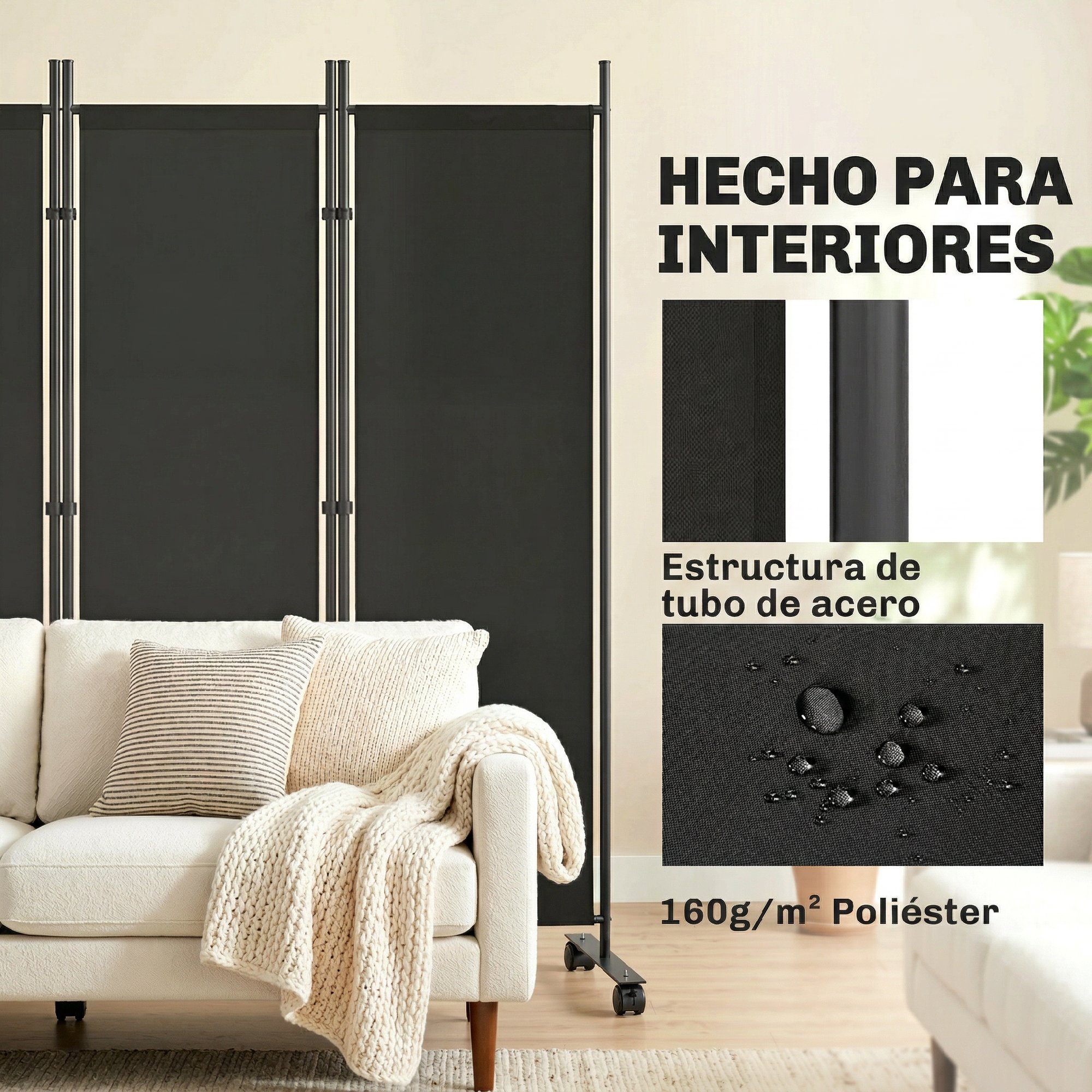 Un separador de ambientes negro con marco metálico junto a un sofá blanco con cojines y manta.