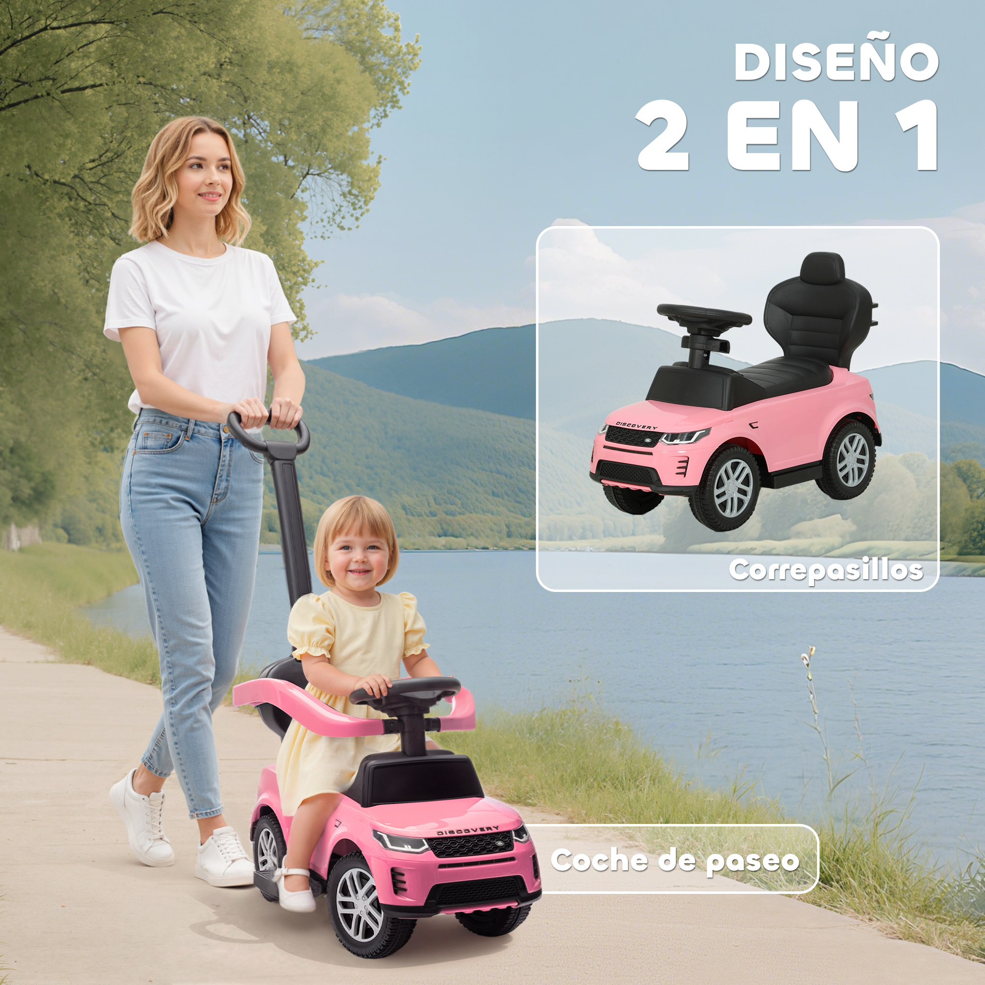 Una mujer empuja a un niño en un coche rosa de juguete por un camino pavimentado junto a un lago, con montañas y árboles.