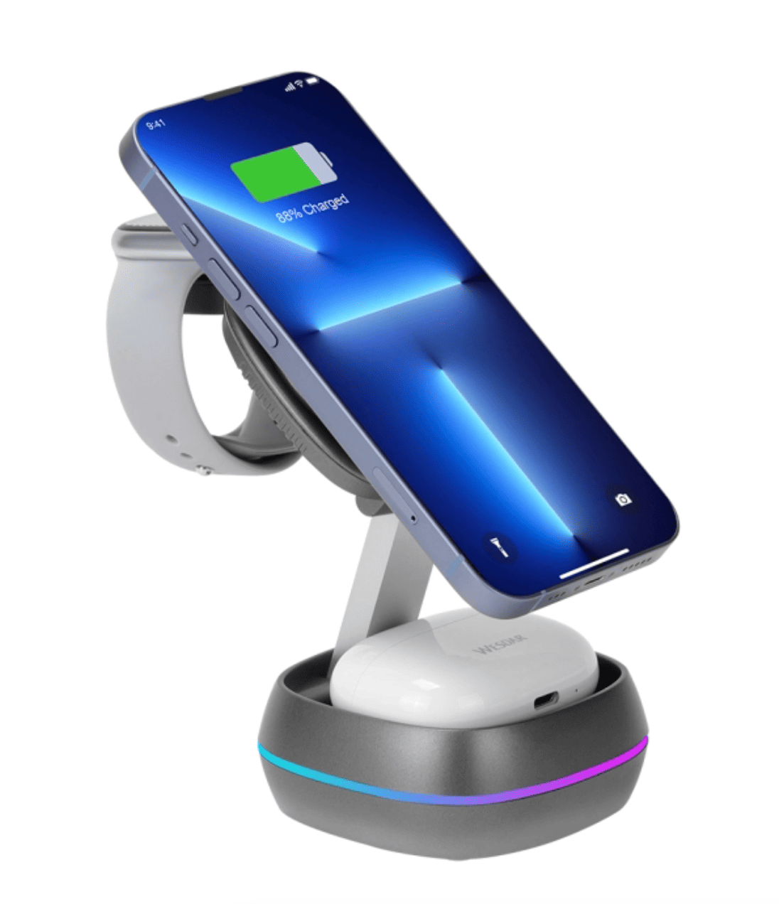 Mavi iPhone, gri Apple Watch ve beyaz kulaklık şarj standında.