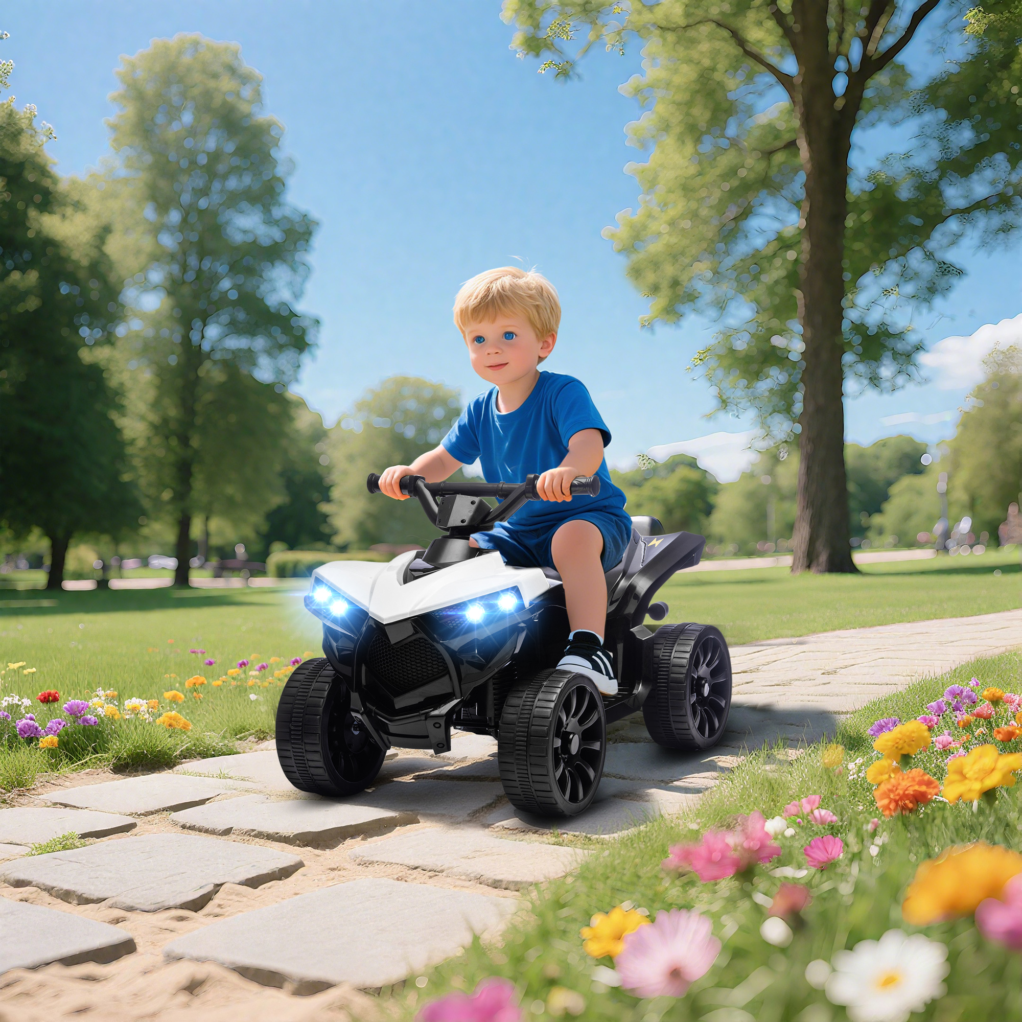Un niño pequeño monta un quad blanco por un camino en un parque.