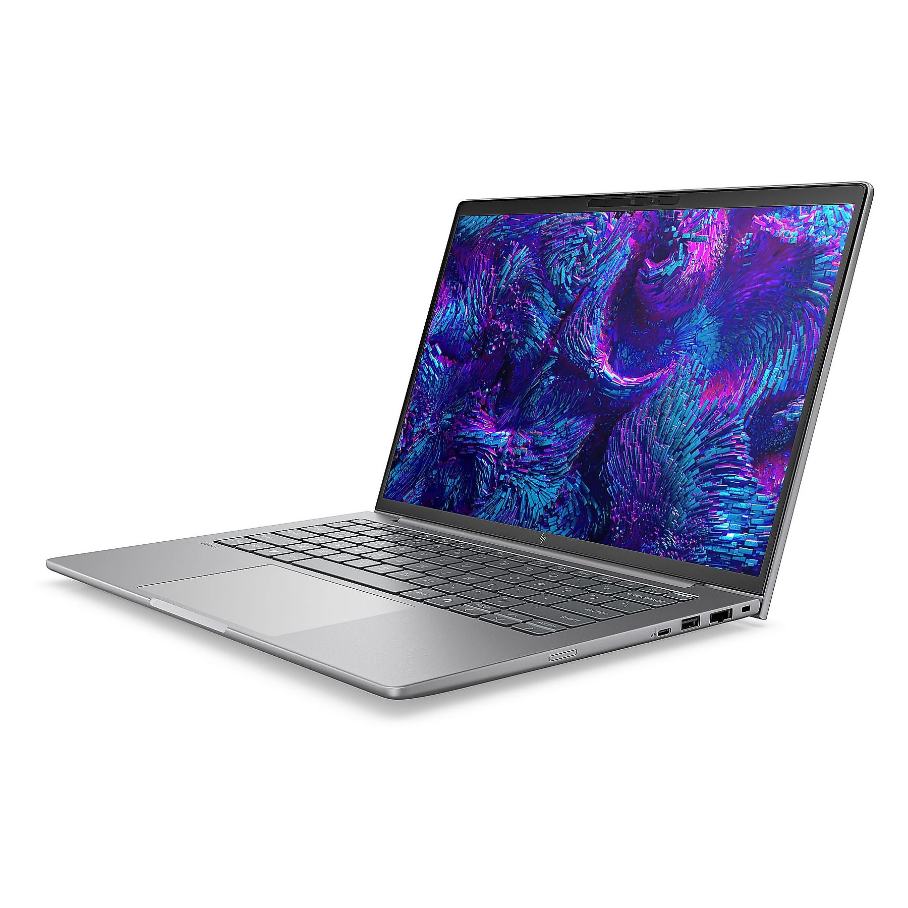 Un laptop argentato è aperto, mostra uno sfondo astratto blu e viola vivace sullo schermo.