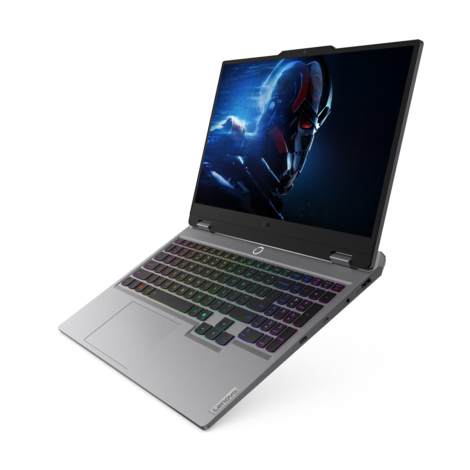 Renkli klavyeli gümüş Lenovo dizüstü bilgisayar ve ekranda fütüristik kask.