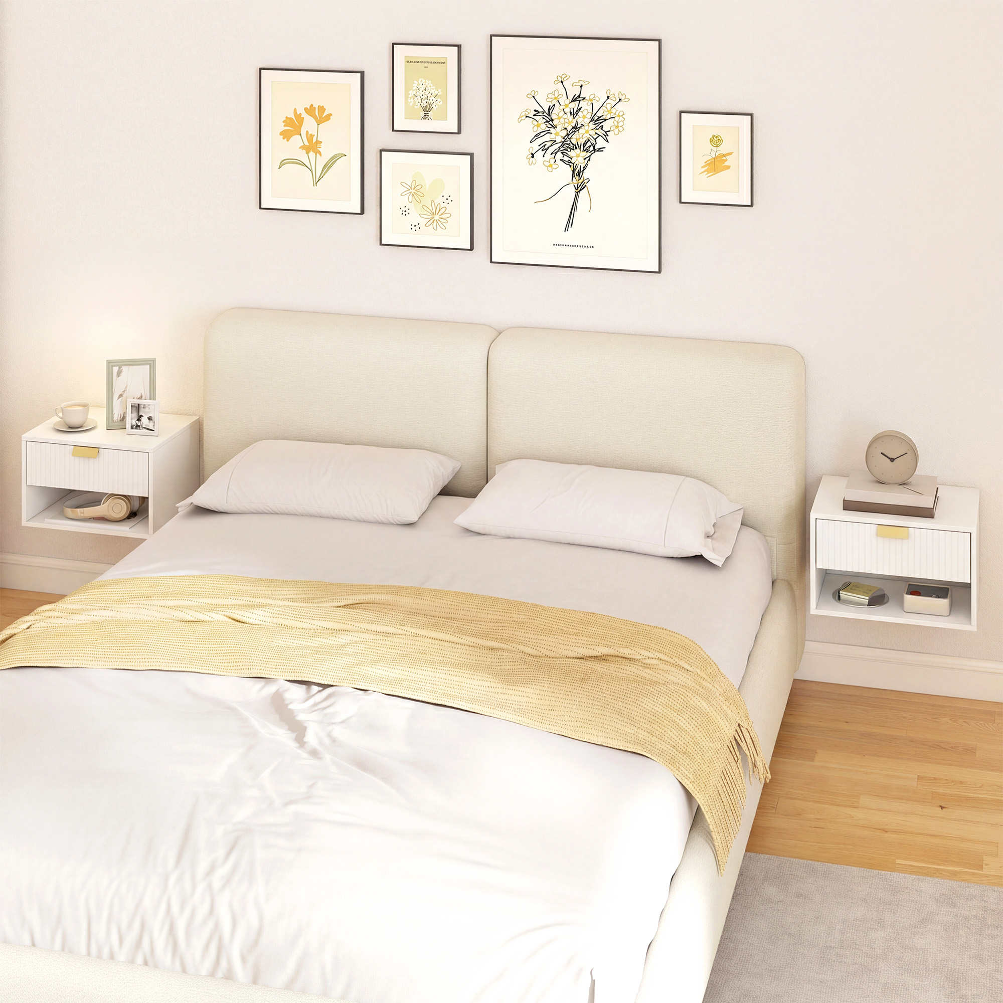 Una escena de dormitorio con cama blanca, manta amarilla, mesitas de noche y arte en la pared.