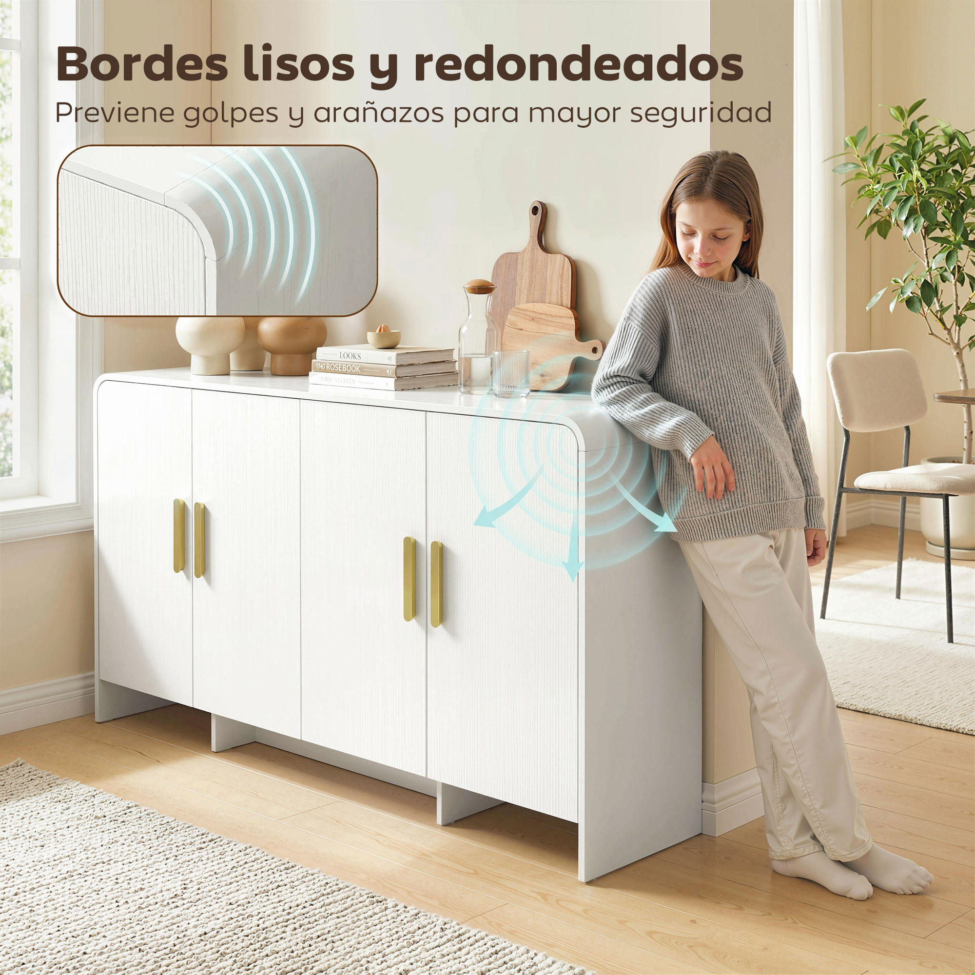 Niña apoyada en mueble blanco con tiradores dorados, primer plano de bordes redondeados.