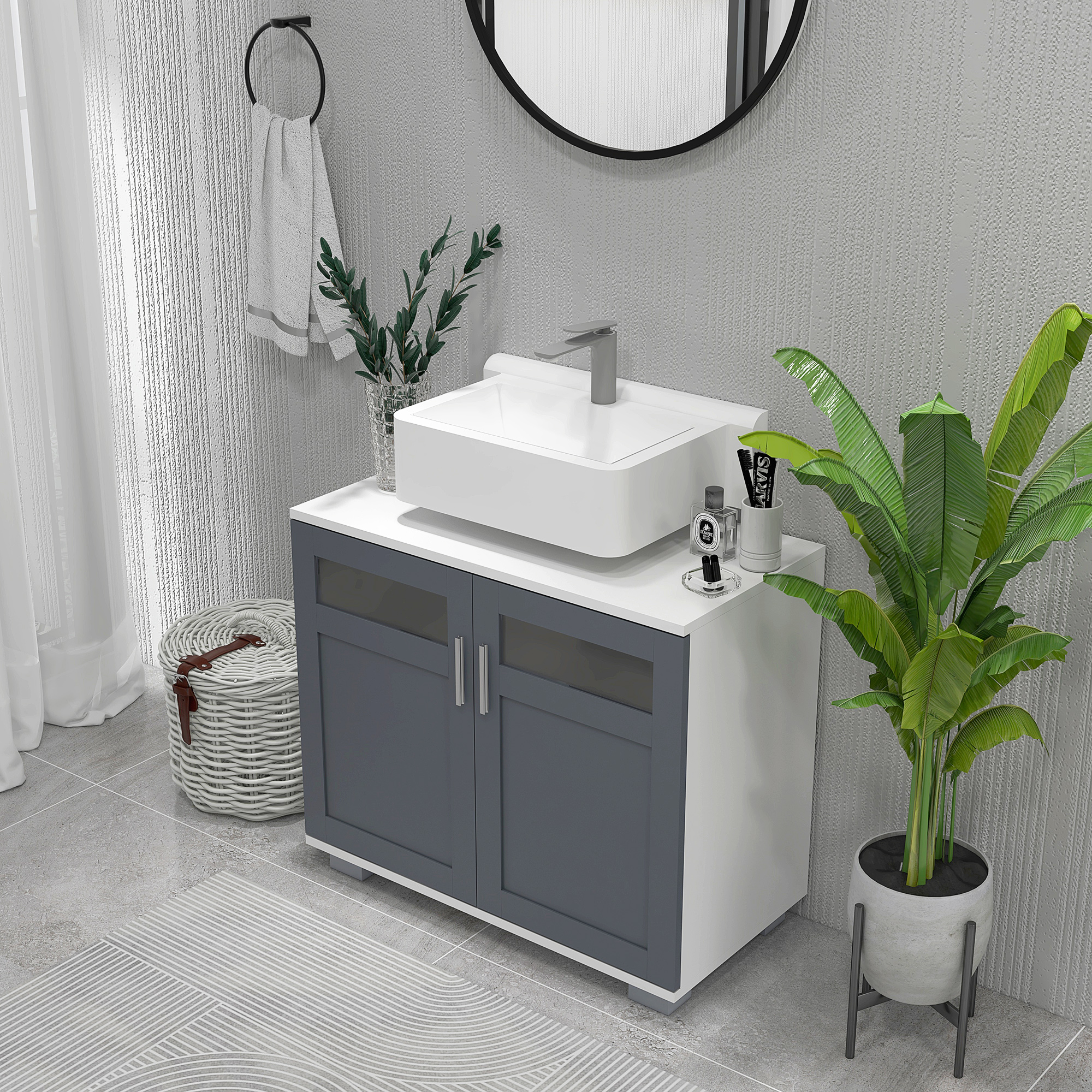 Mueble de baño con lavabo, espejo, cesta, planta y toallero.