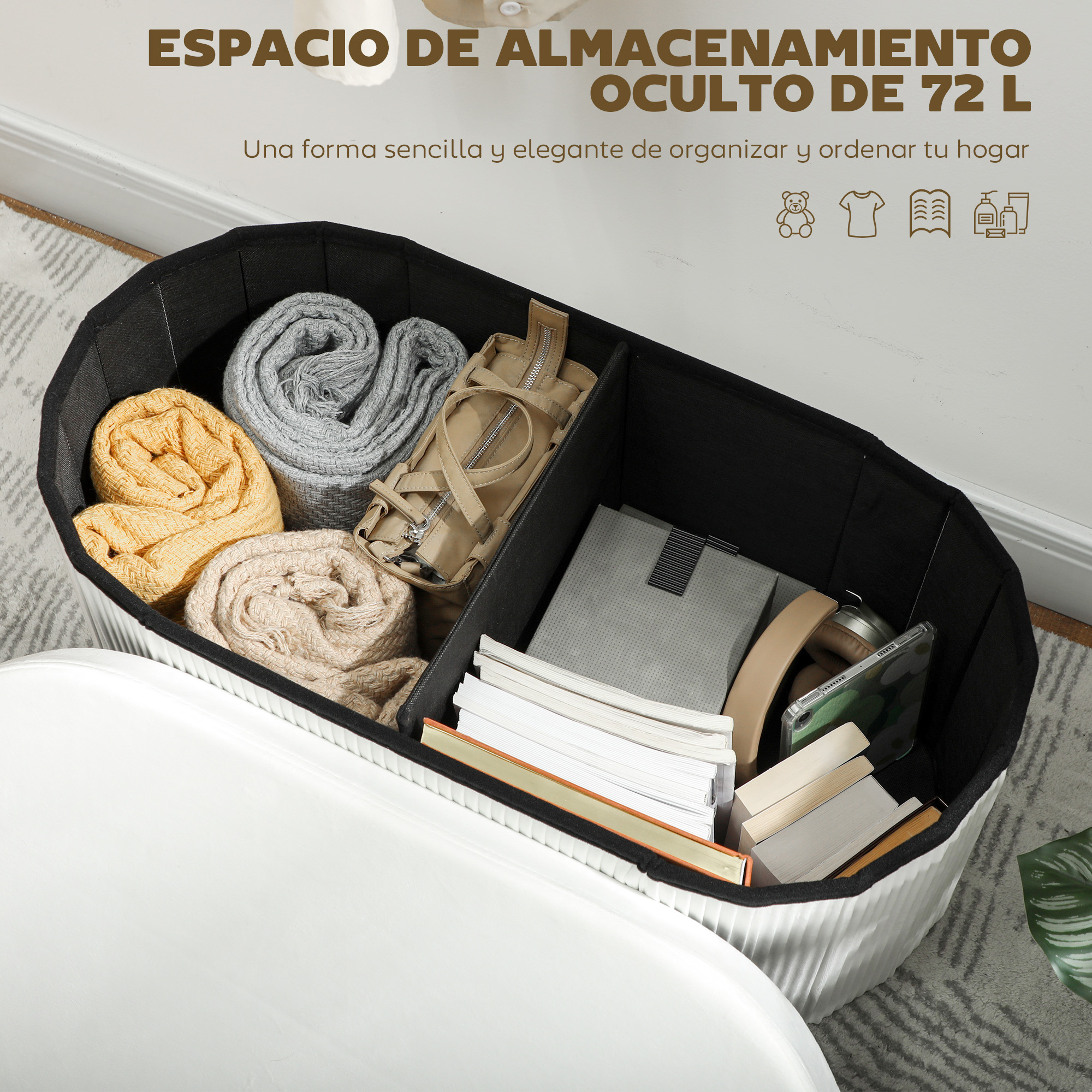 Cesto abierto con mantas, bolso, libros y auriculares dentro.