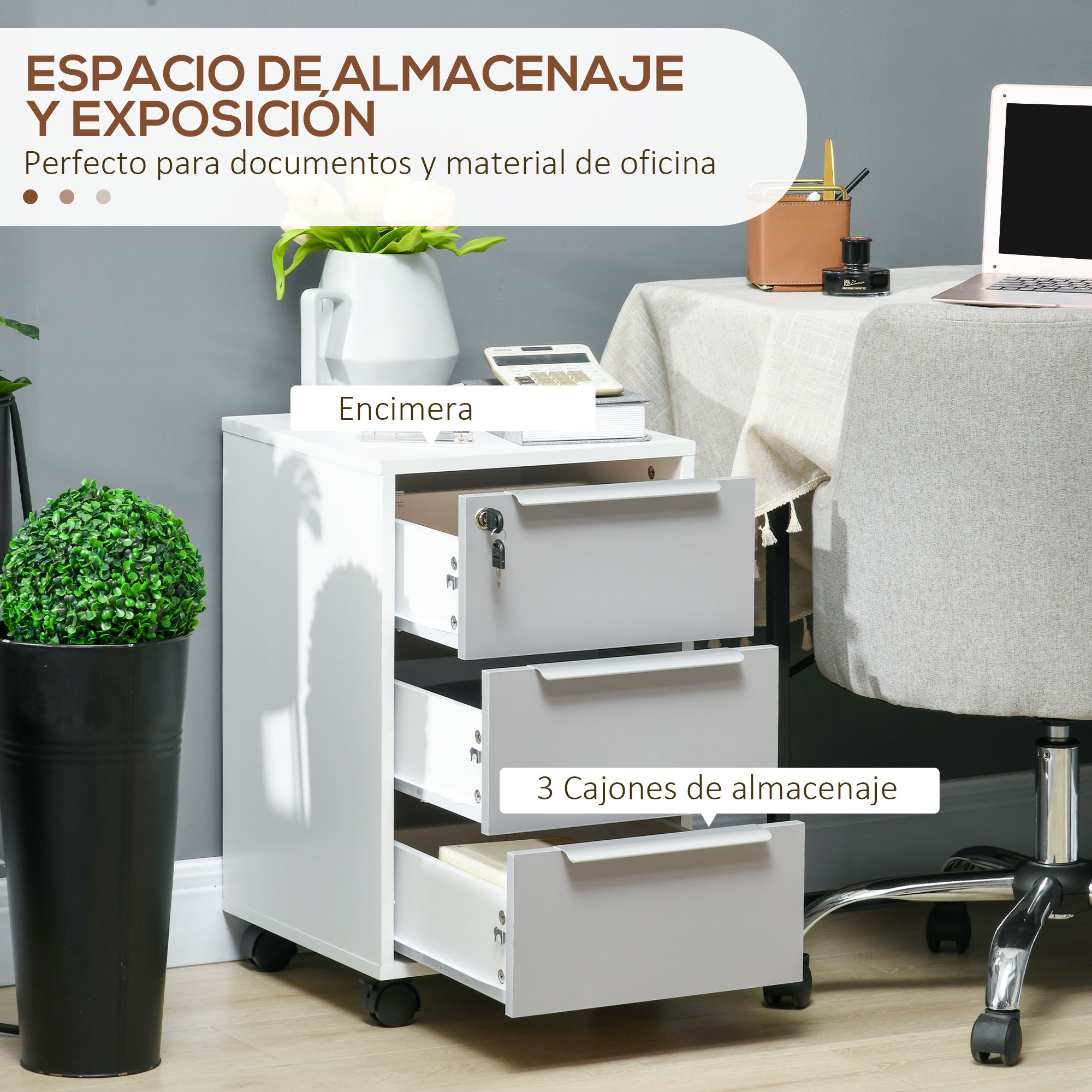 Un archivador blanco con tres cajones junto a una planta verde en maceta.