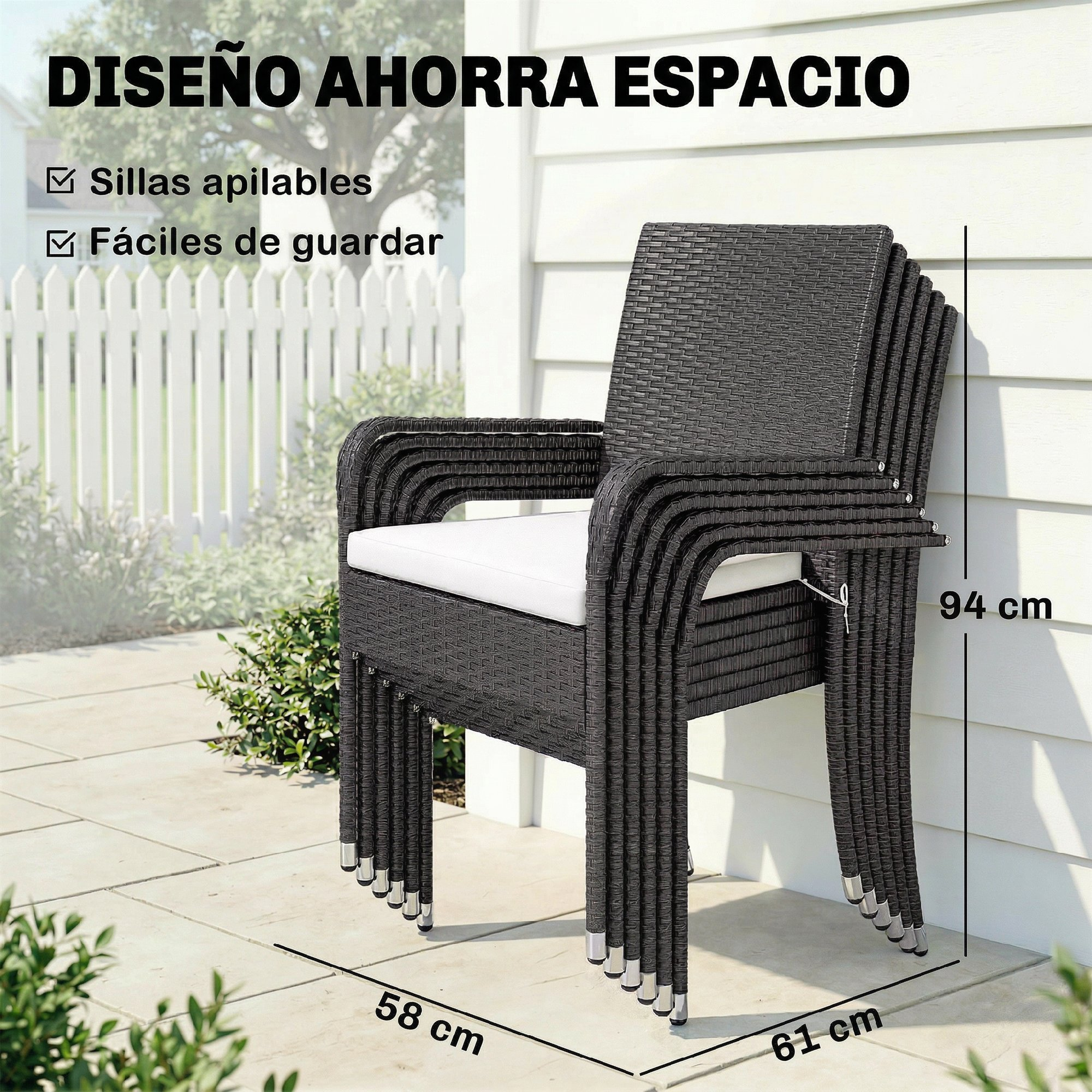 Sillas apiladas de ratán gris oscuro con cojines blancos junto a una casa.