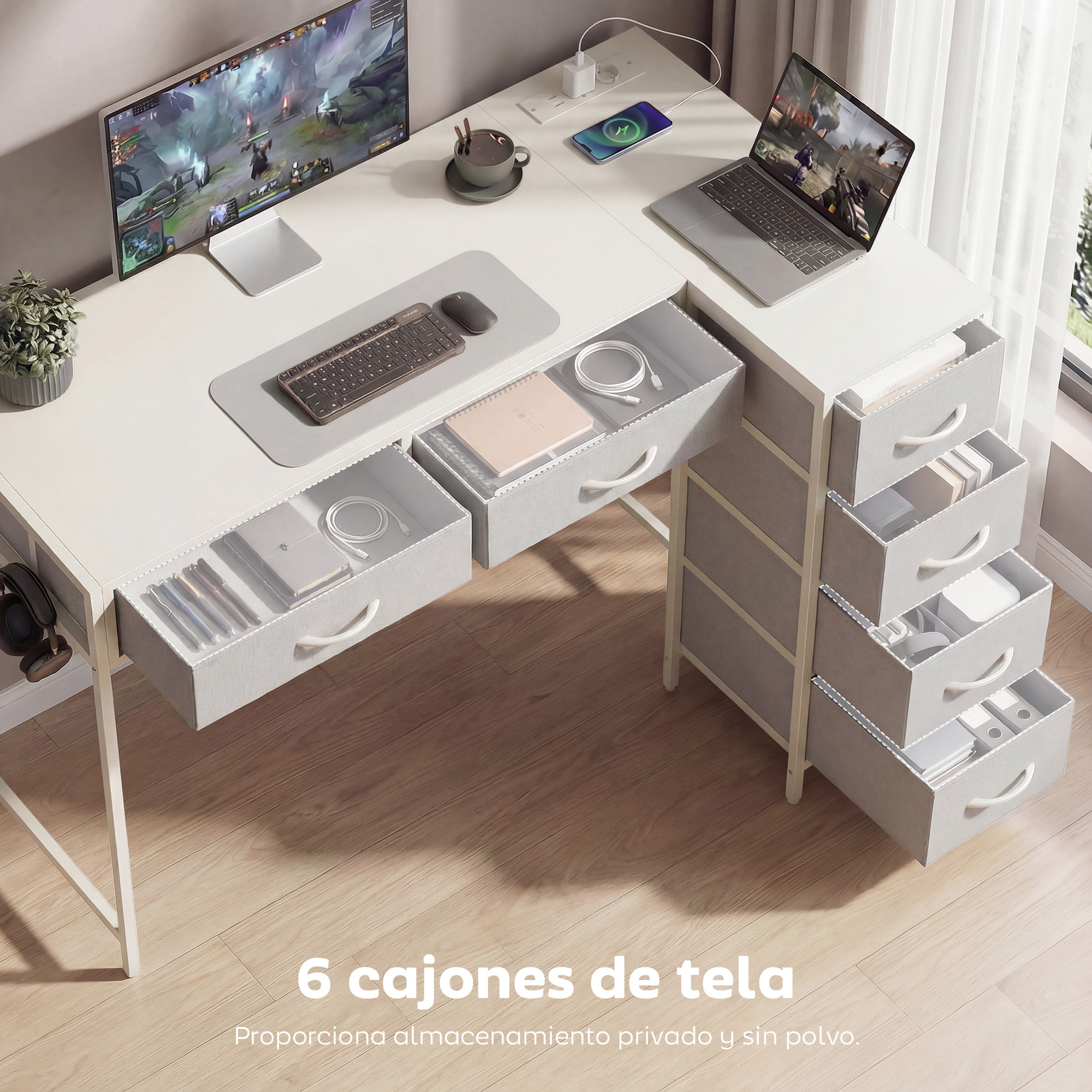 Un escritorio moderno con ordenadores, portátil, taza y cajones de tela abiertos con suministros.