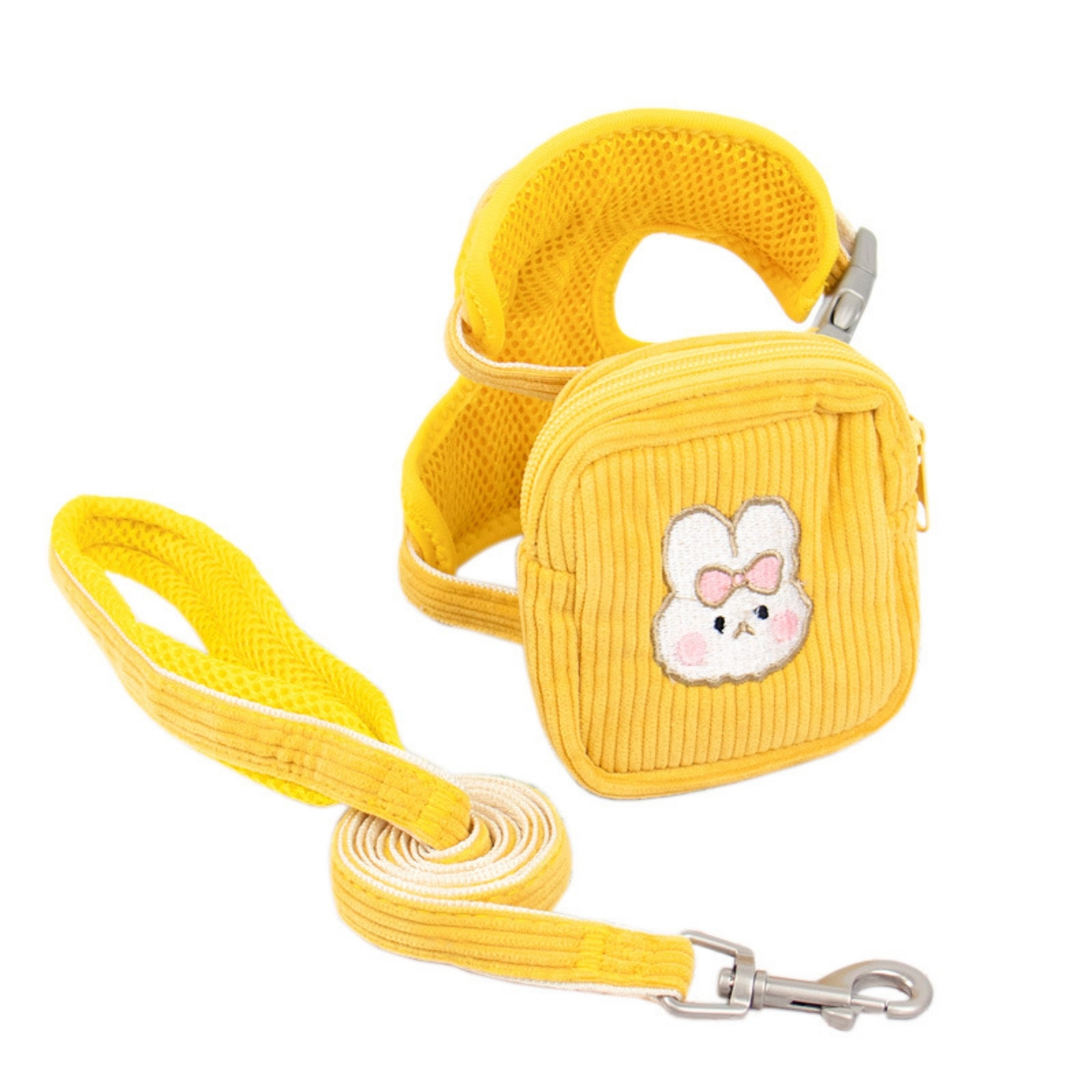 Ein gelber Hundegeschirr mit Leine und einer kleinen Tasche mit Hasenmotiv.