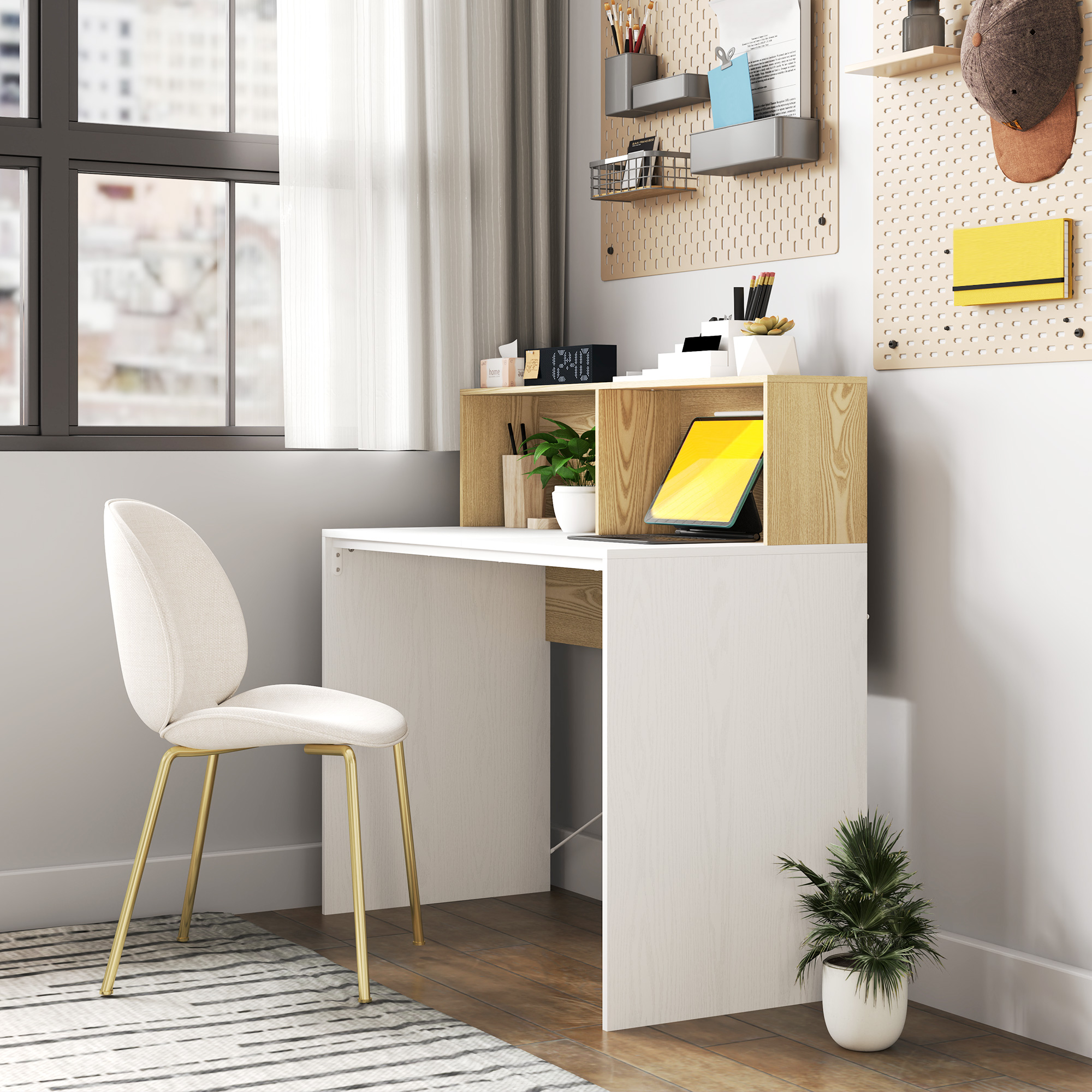 Un escritorio moderno con una silla blanca y una tableta.