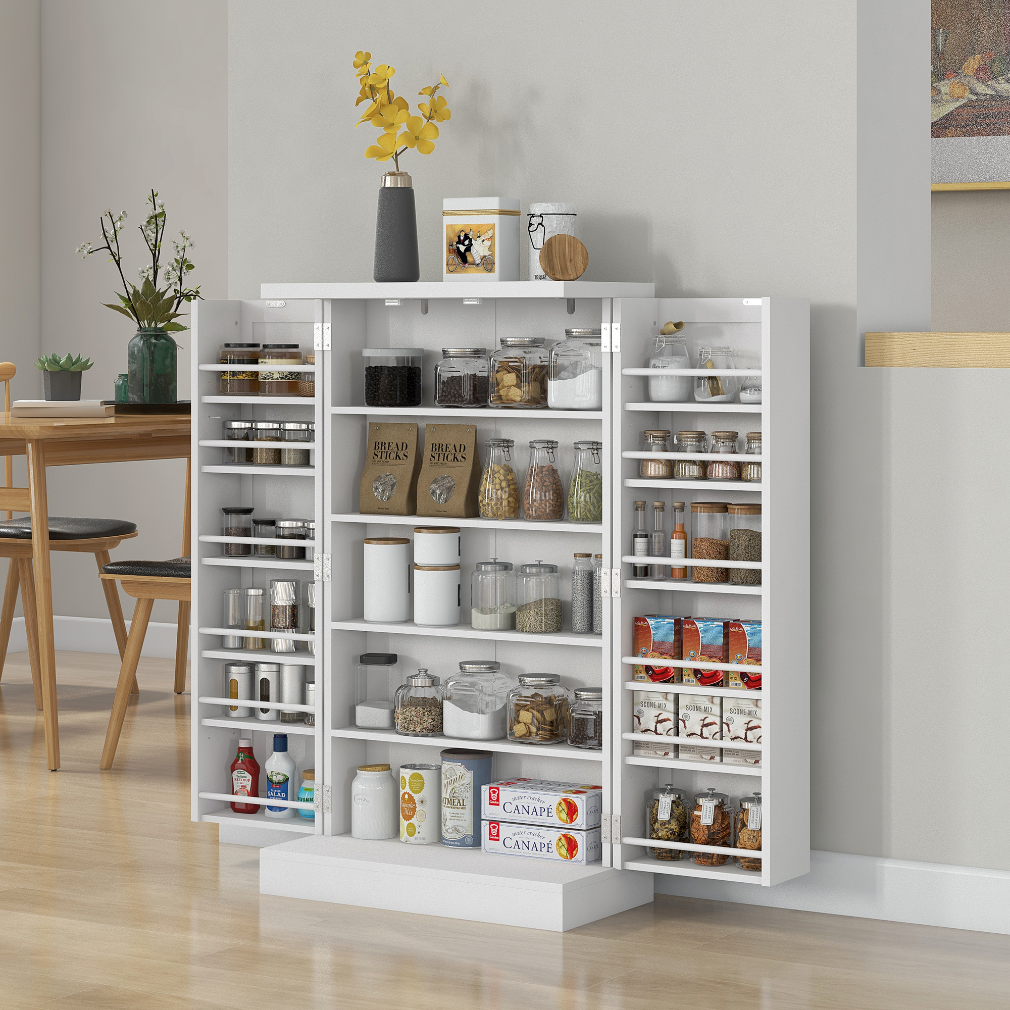 Un armario de cocina blanco abierto lleno de provisiones, frascos y latas.