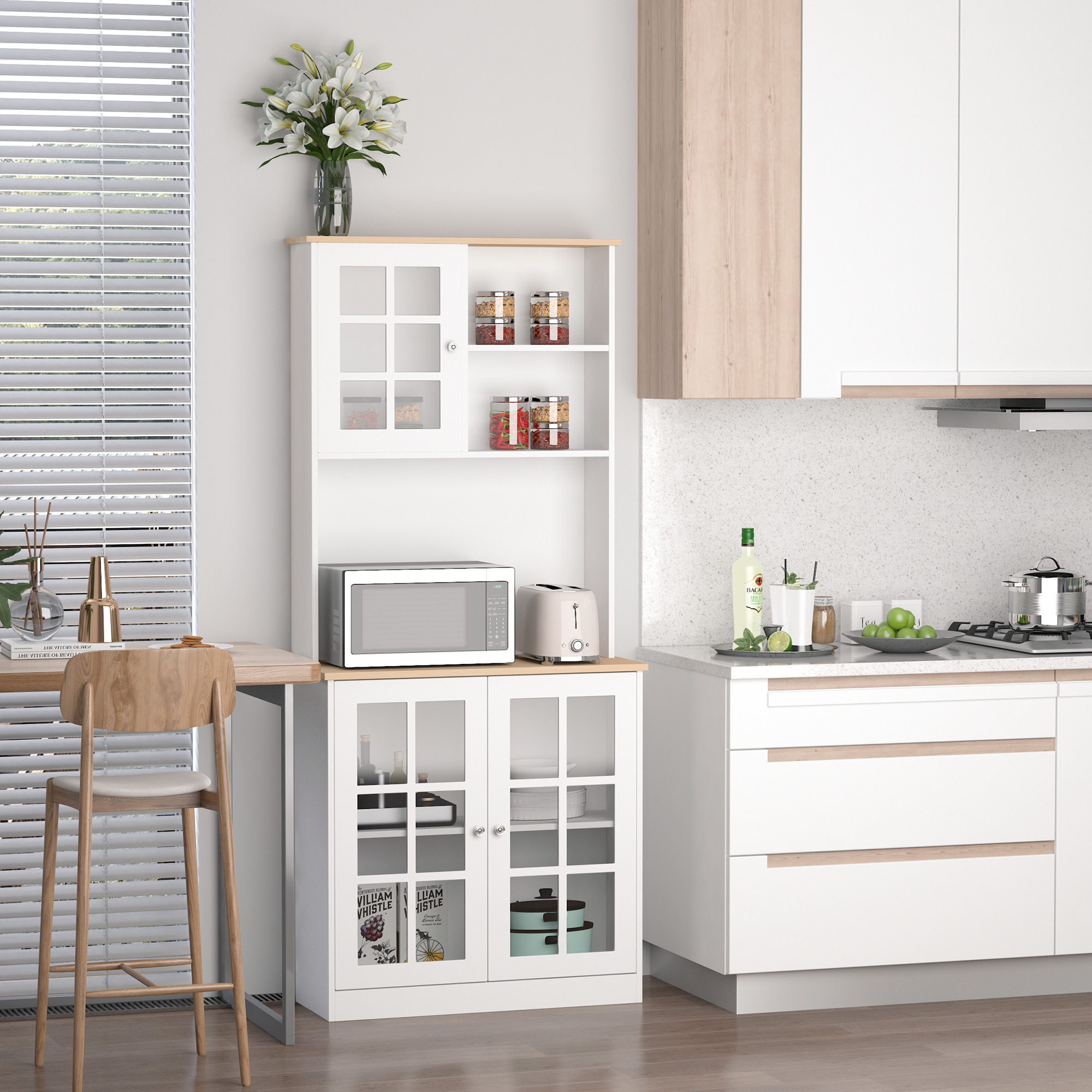 Una cocina moderna con aparador blanco, microondas, tostadora y taburete de bar.