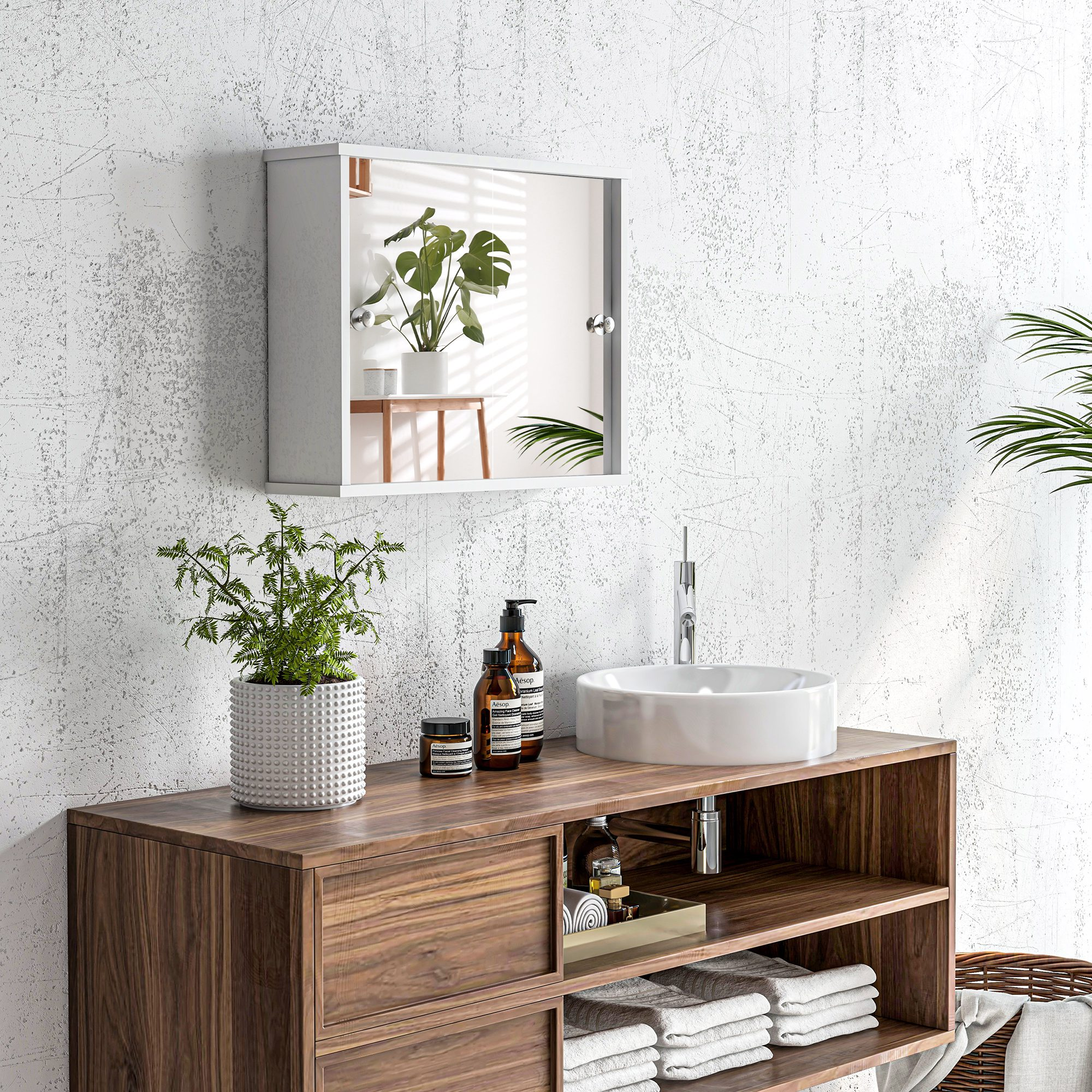 Un mueble de baño de madera con lavabo, espejo y plantas.