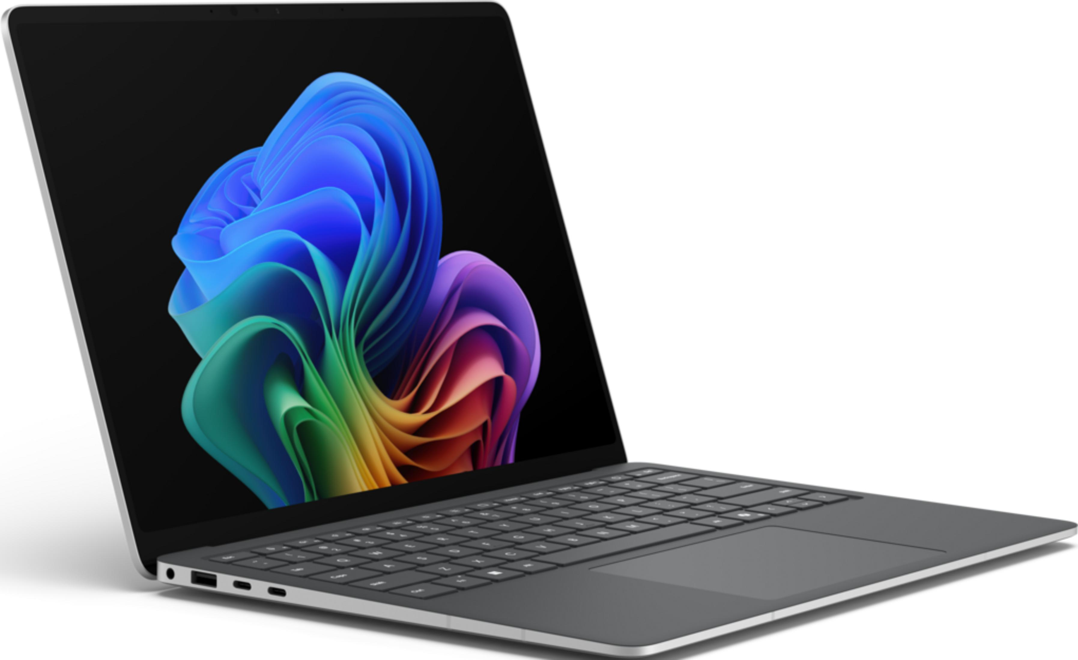 Ein geschlossenes graues Laptop mit einem bunten Hintergrundbild auf dem Bildschirm.