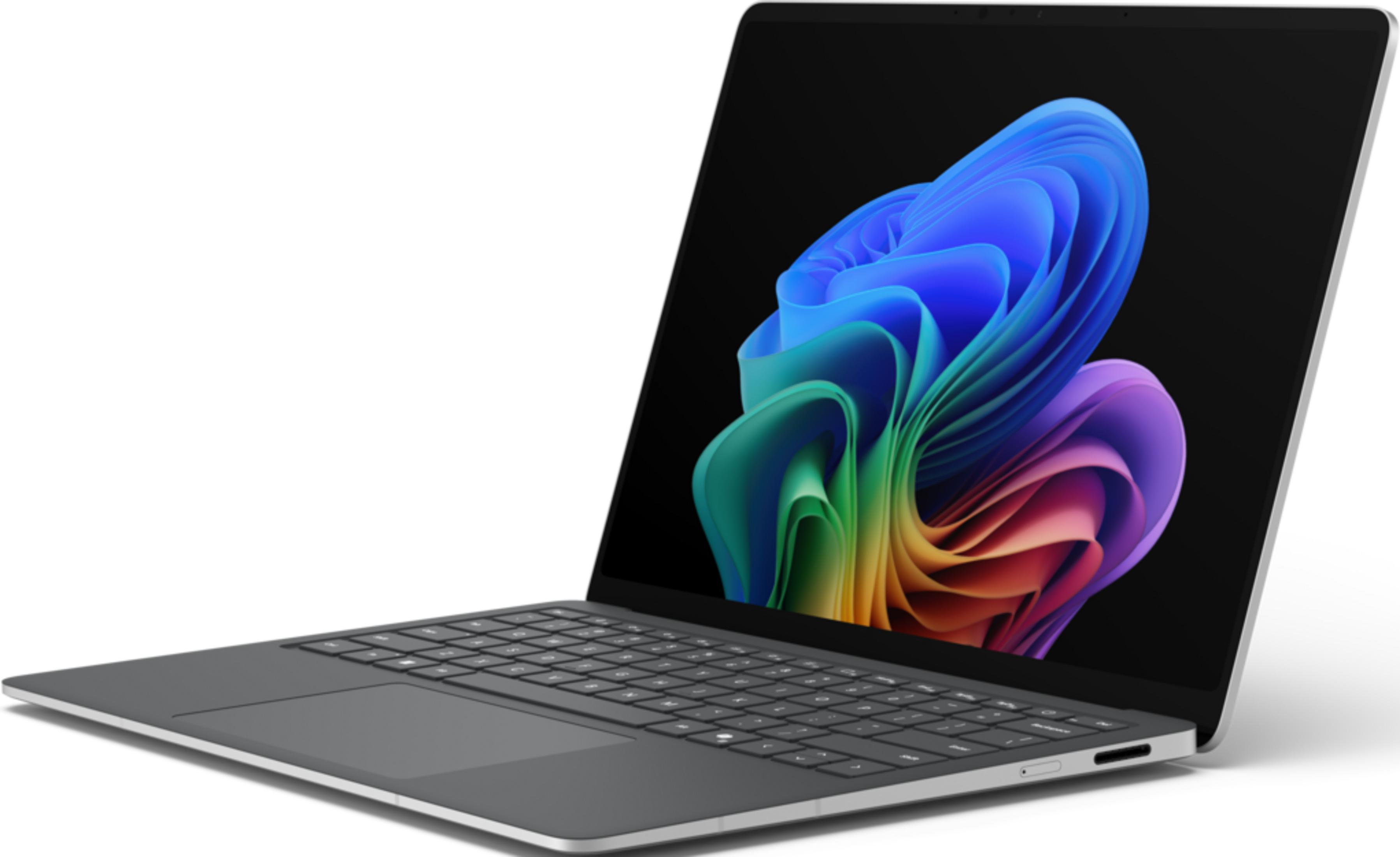 Grauer Laptop mit buntem, abstraktem Hintergrund auf dem Bildschirm.