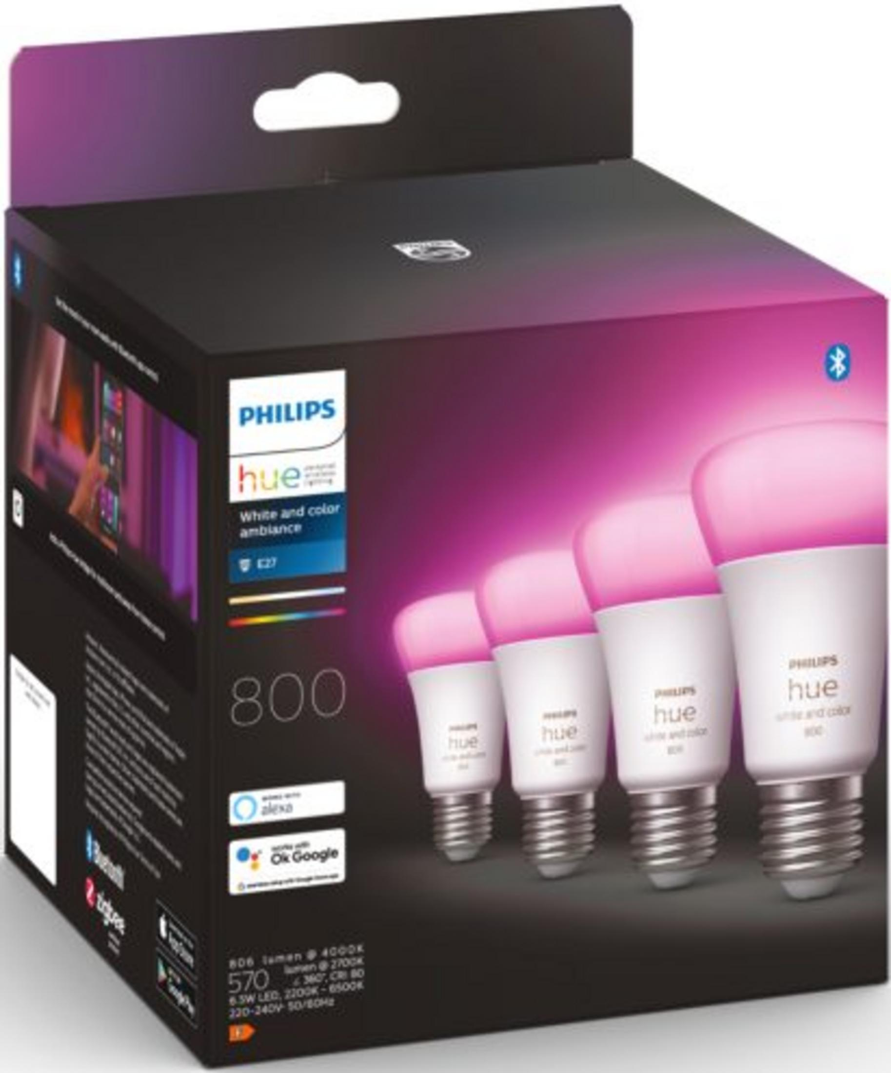 Scatola di lampadine Philips Hue bianche e colorate, mostra quattro lampadine accese di rosa.