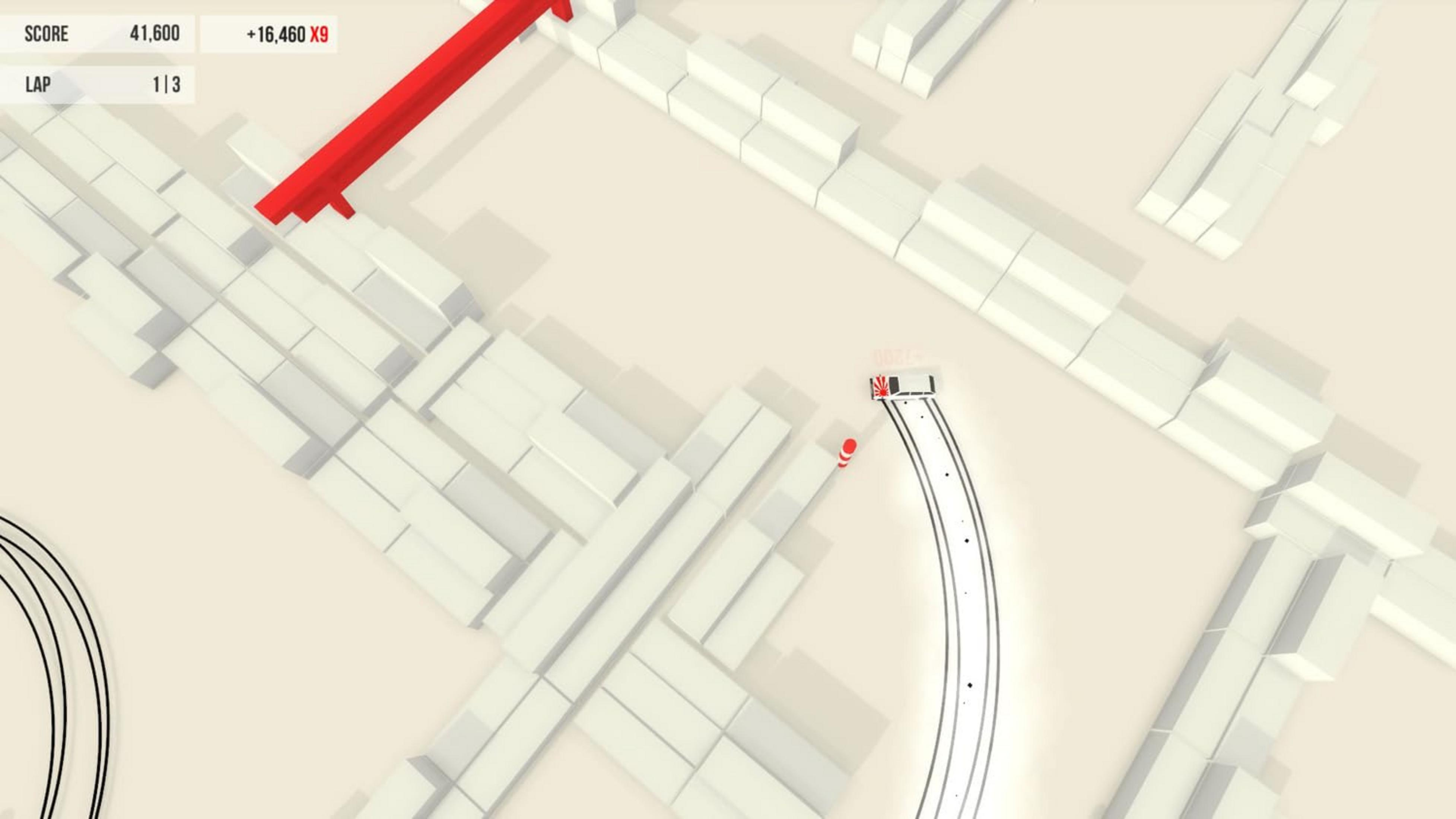 Ein weißes Auto fährt auf einer Rennstrecke mit weißen Blöcken und einer roten Rampe.