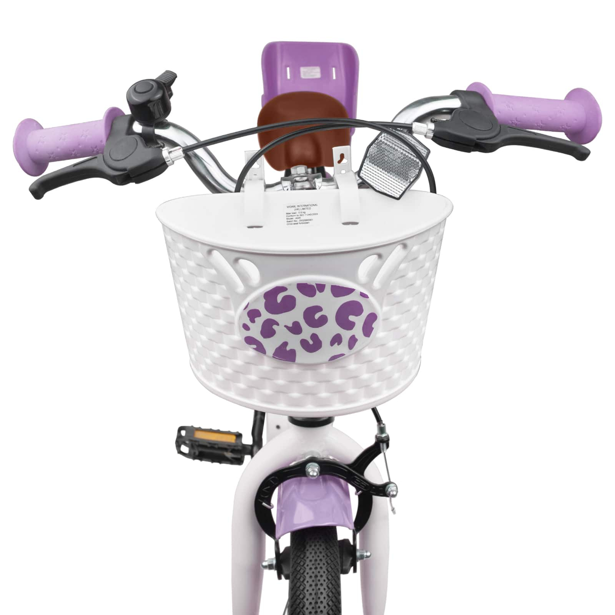 Ein rosa Kinderfahrrad mit weißem Korb und lila Leopardenmuster.