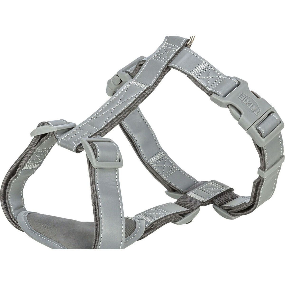 Un arnés gris para perros con costuras reflectantes y hebillas de plástico. Es visible la marca TRIXIE.