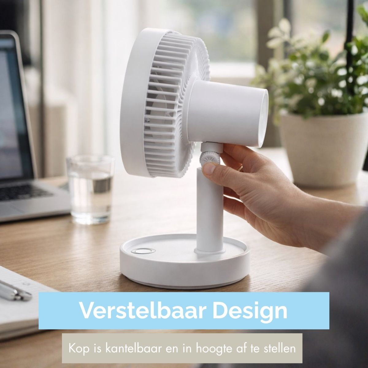 A white desk fan with an adjustable head on a wooden desk.