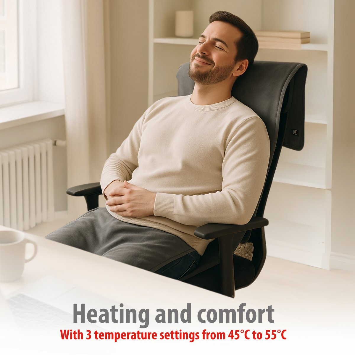 Man relaxing in a chair with a heating pad. Heating and comfort.