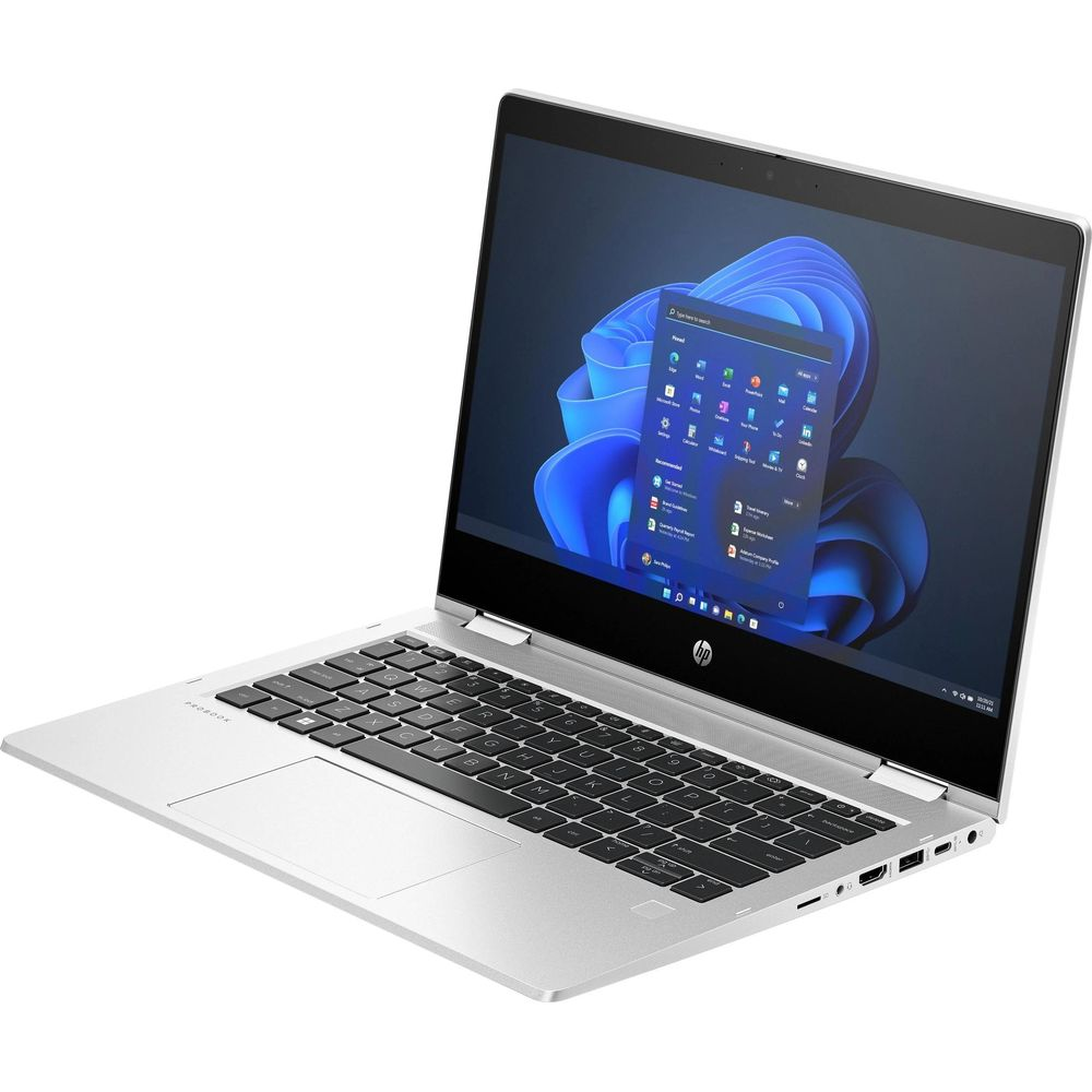 Silberner HP Laptop offen mit blauem abstrakten Hintergrundbild auf dem Bildschirm. Tastatur sichtbar.