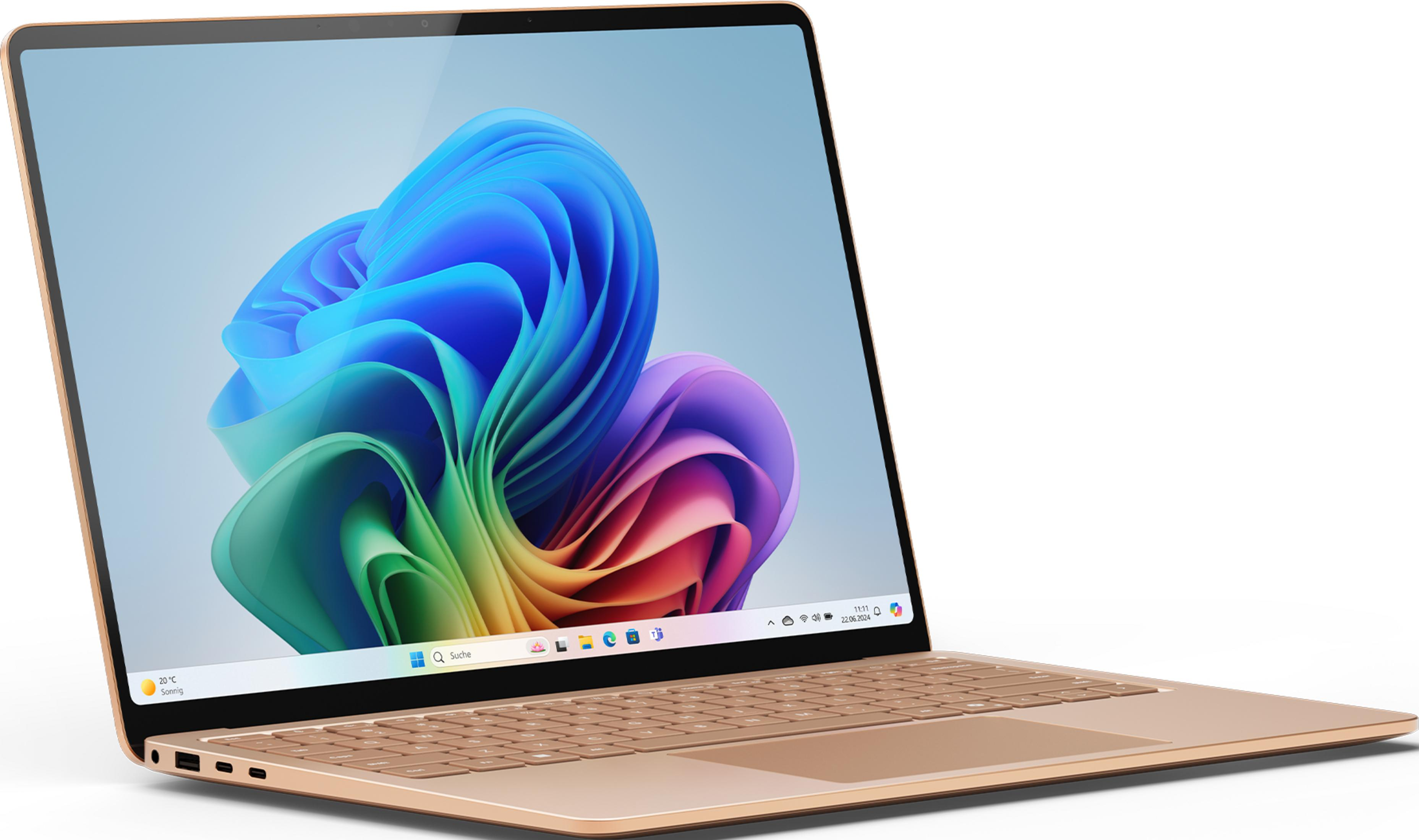 Ein goldener Laptop mit einem bunten Windows-Hintergrund, Tastatur und Anschlüssen.