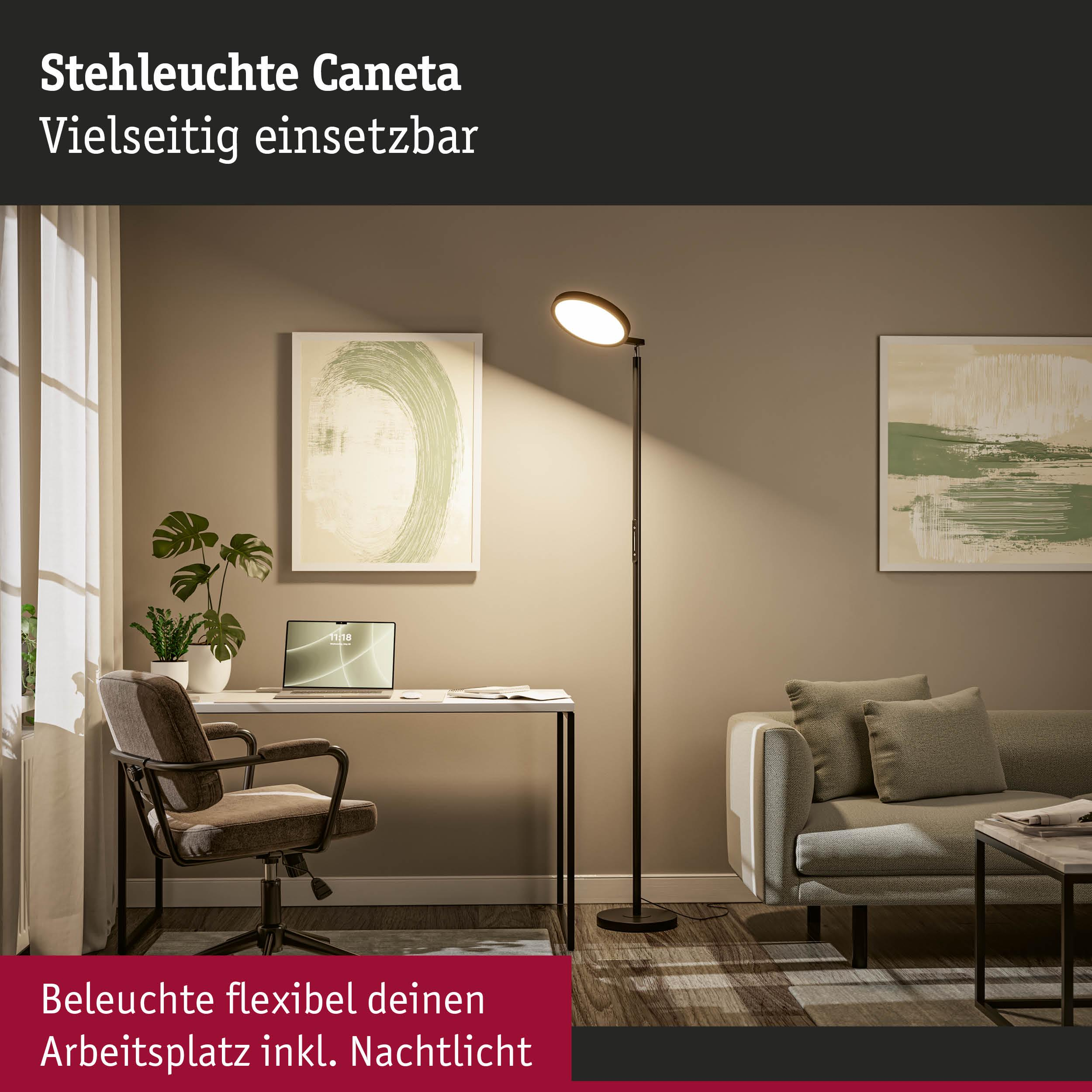 Lampa podłogowa oświetla biurko z laptopem i fotelem.